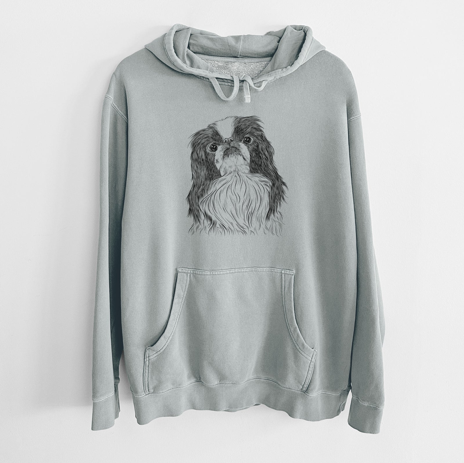 Hand-drawn sketch of Suki the Japanese Chin on a Sage Unisex pigment dyed hoodie