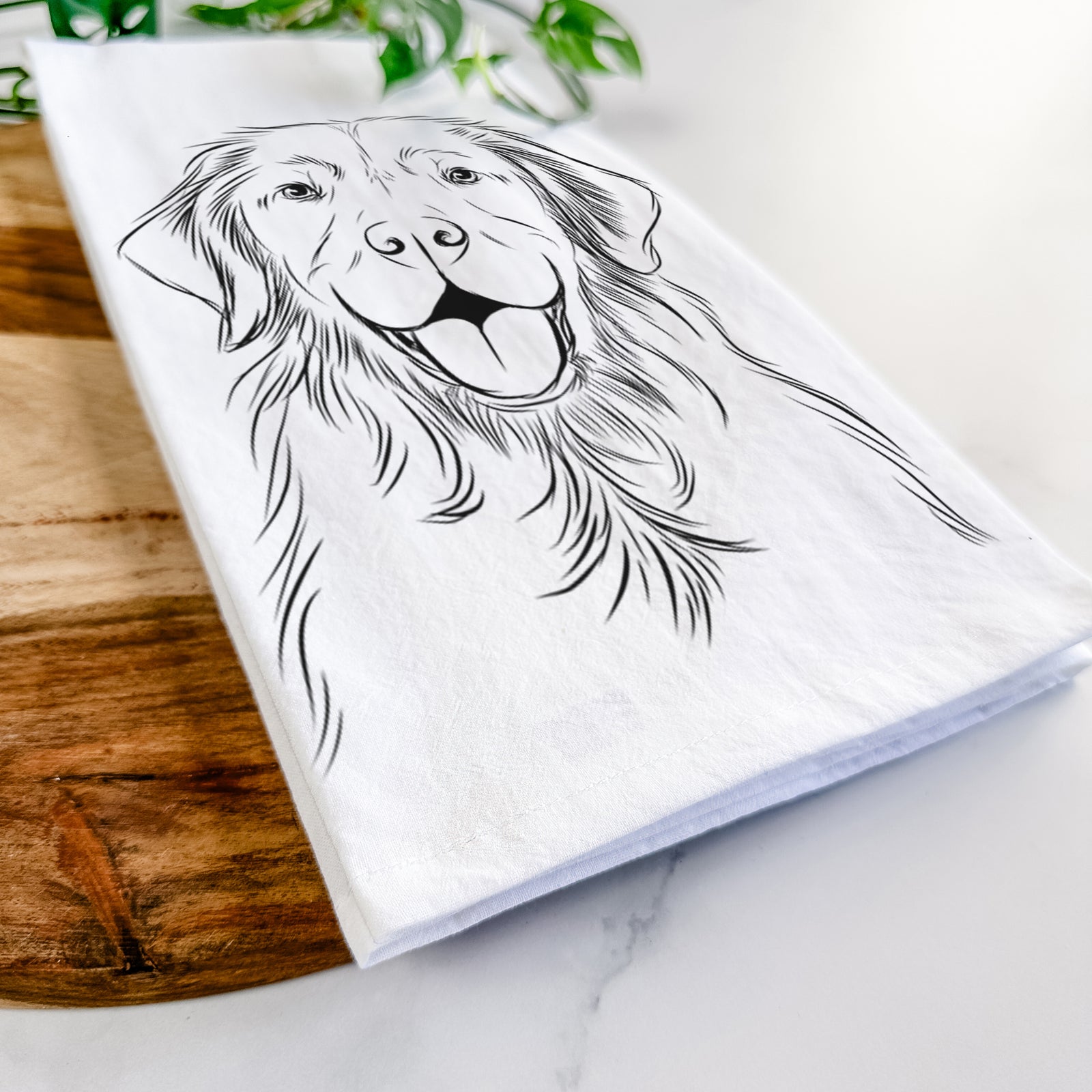 Hand-drawn sketch of Sunny the Golden Retriever on a tea towel