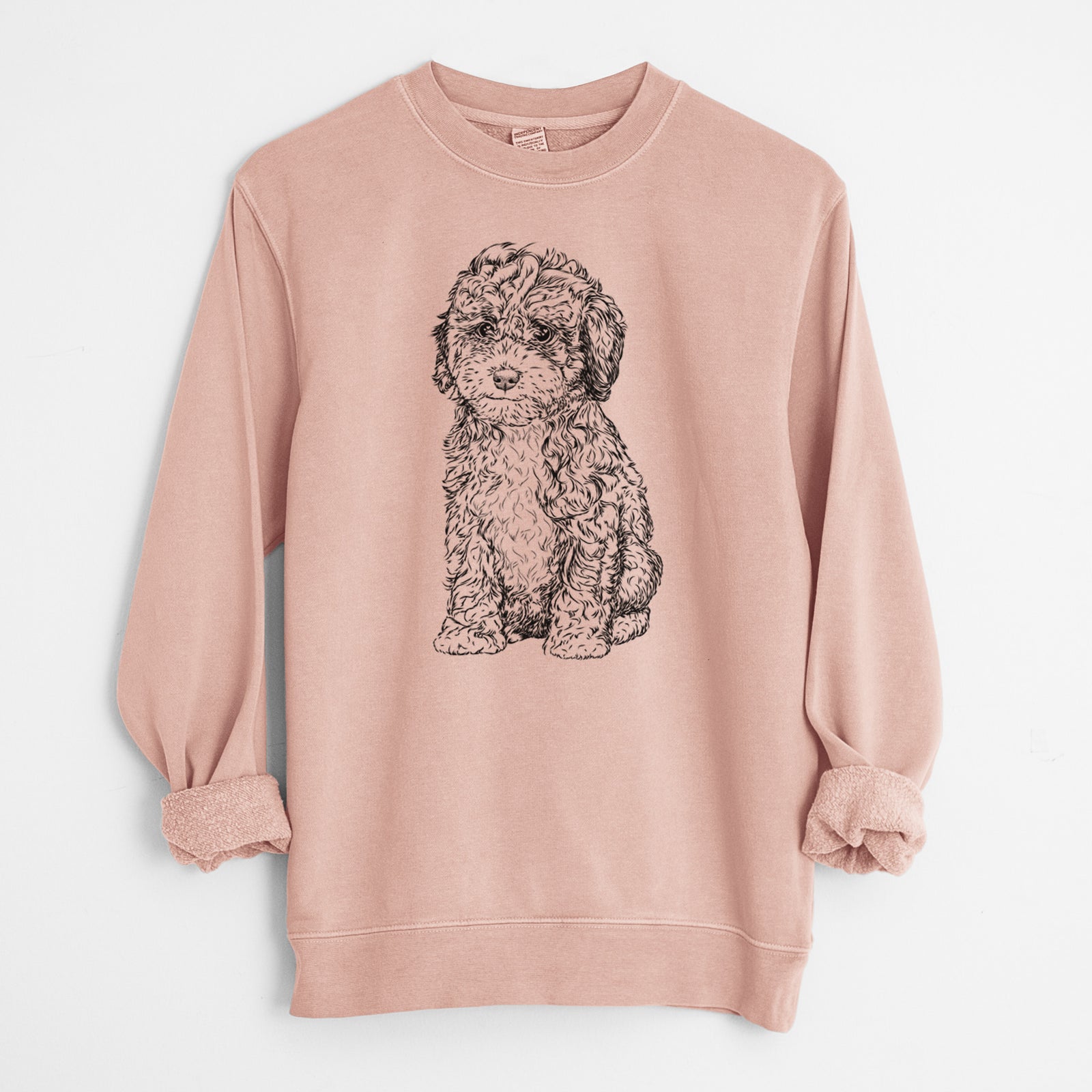 Hand-drawn sketch of Sweet Tea the Mini Doodle on a Dusty Pink Unisex pigment dyed crew sweatshirt