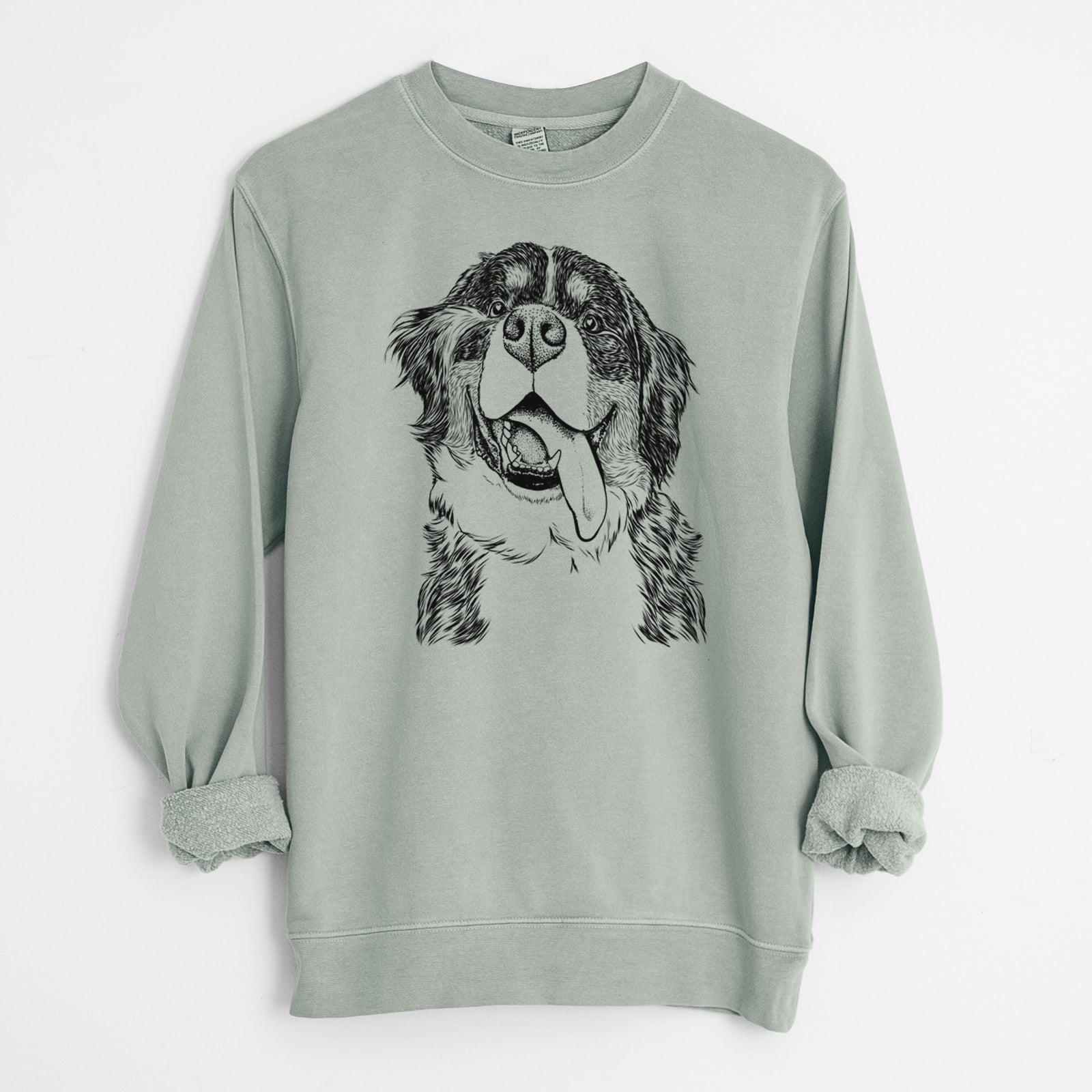 Hand-drawn sketch of Theo the Bernese Mountain Dog on a Sage Unisex pigment dyed crew sweatshirt