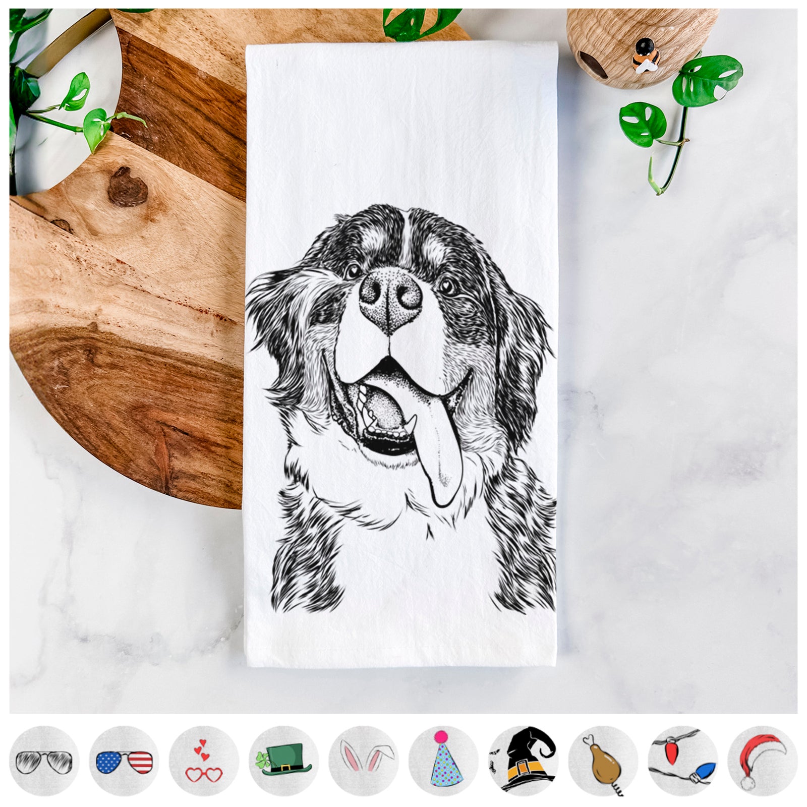 Hand-drawn sketch of Theo the Bernese Mountain Dog on a tea towel, shown with icons of the other available costume styles