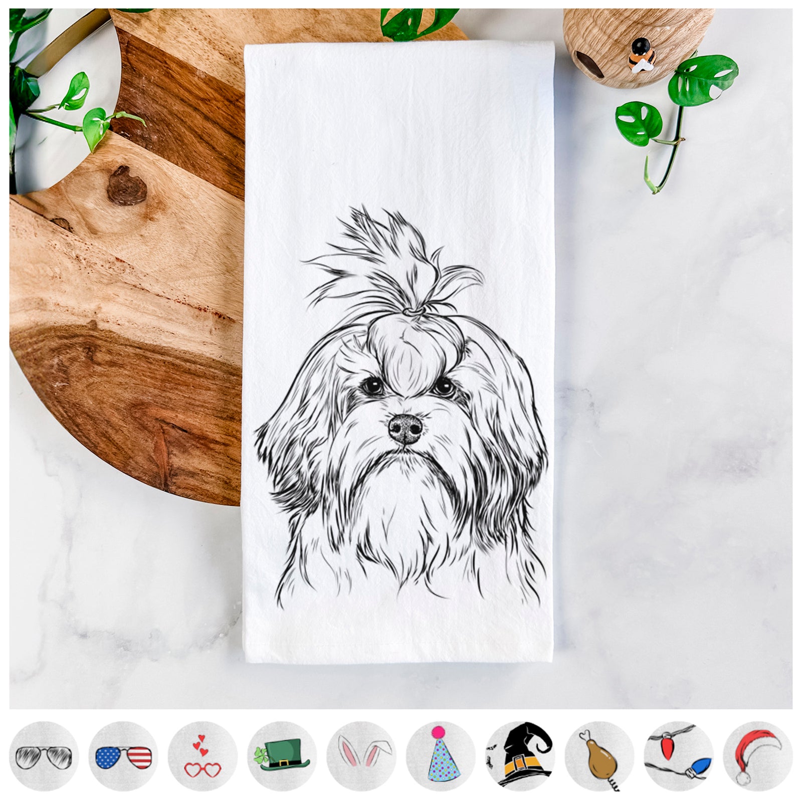 Hand-drawn sketch of Tootsie the Lowchen on a tea towel, shown with icons of the other available costume styles