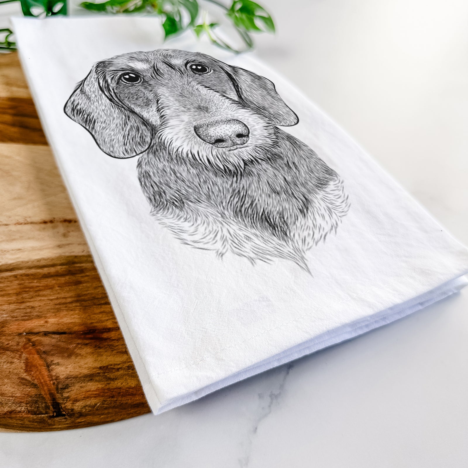 Hand-drawn sketch of Truman the Wirehaired Dachshund on a tea towel