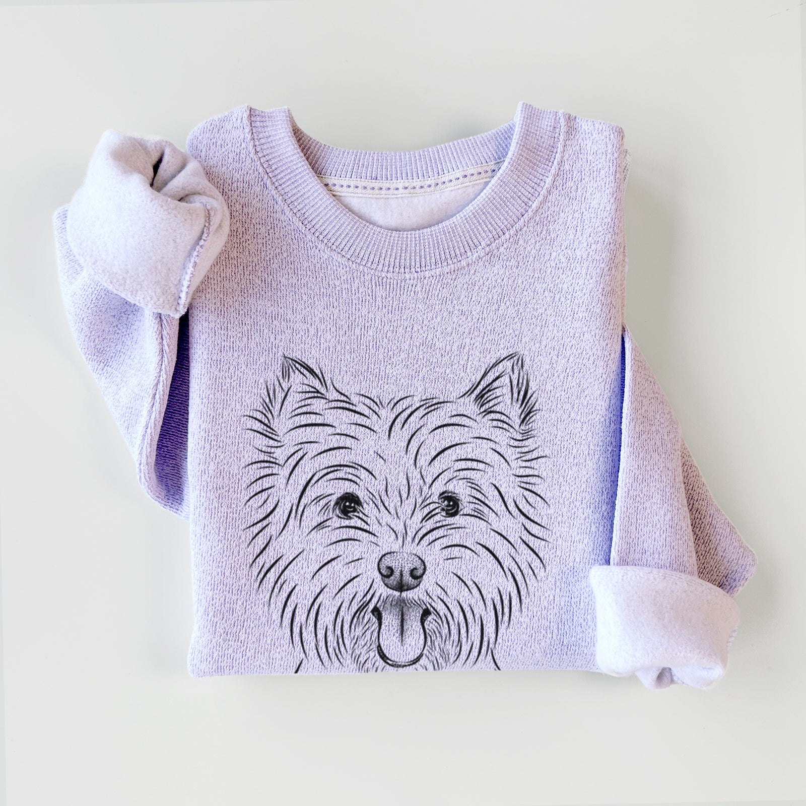 Hand-drawn sketch of Welma the West Highland Terrier on an Ice Purple knit sweatshirt