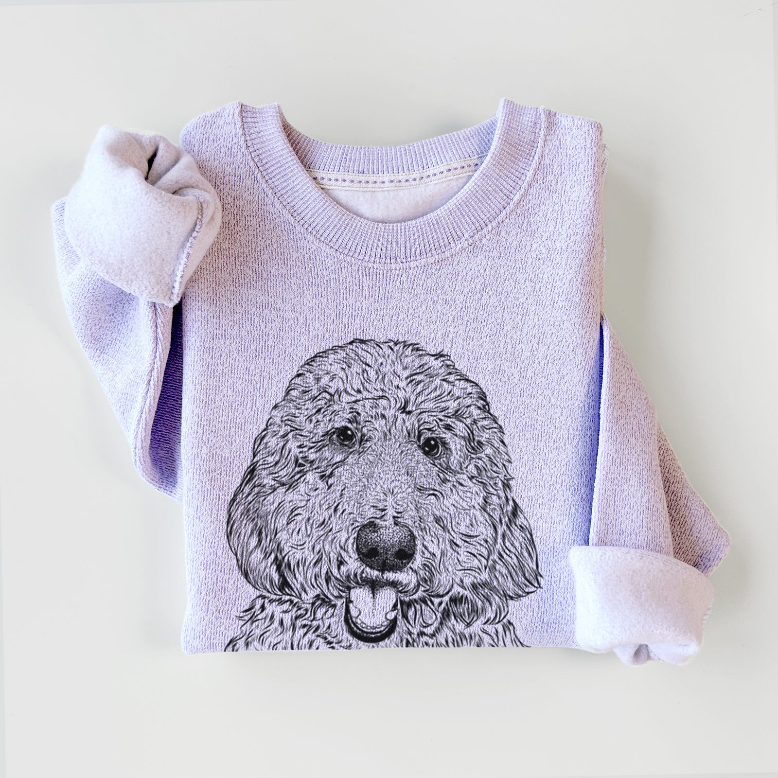 Hand-drawn sketch of Whisper the Goldendoodle on an Ice Purple knit sweatshirt