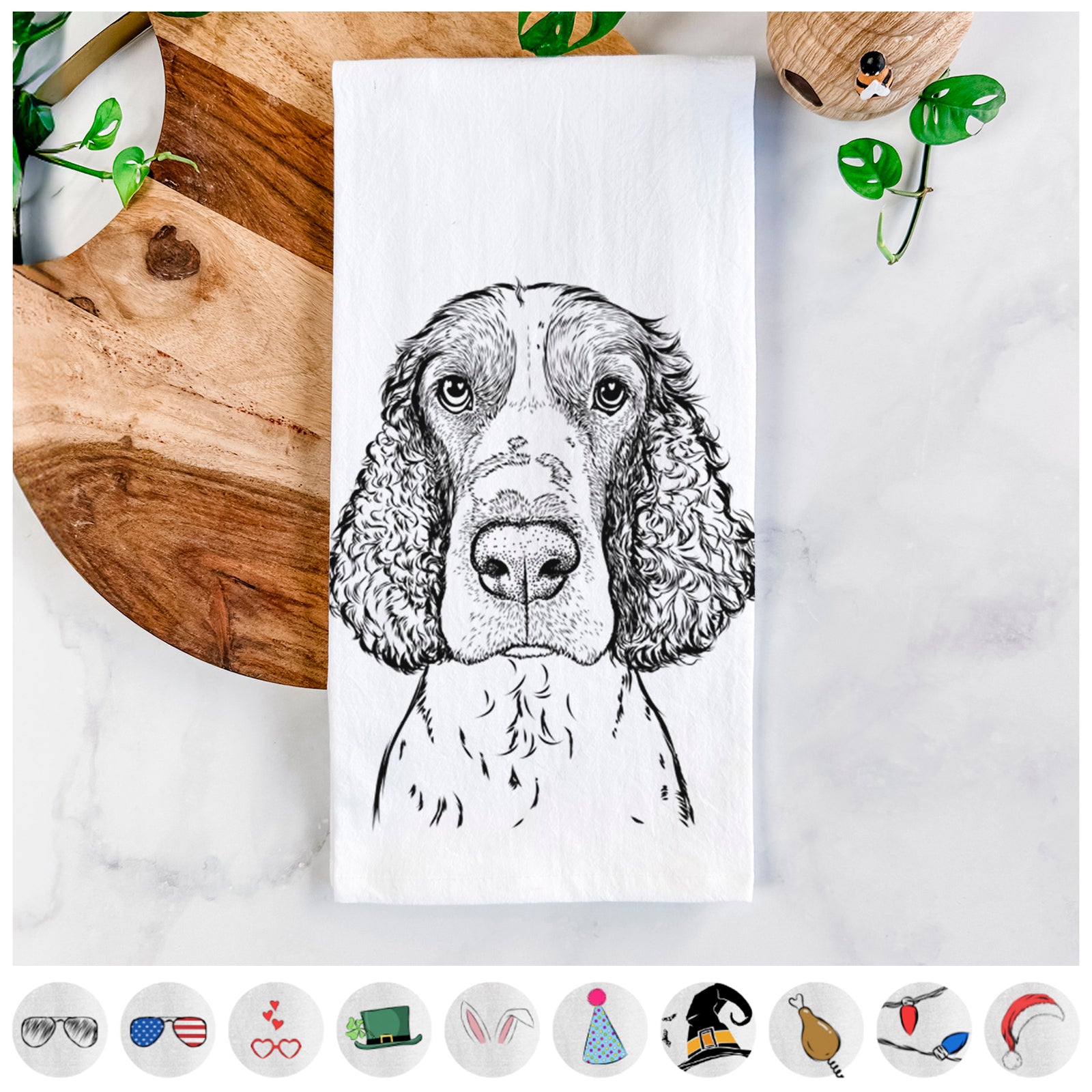 Hand-drawn sketch of Wilbur the English Springer Spaniel on a tea towel, shown with icons of the other available costume styles