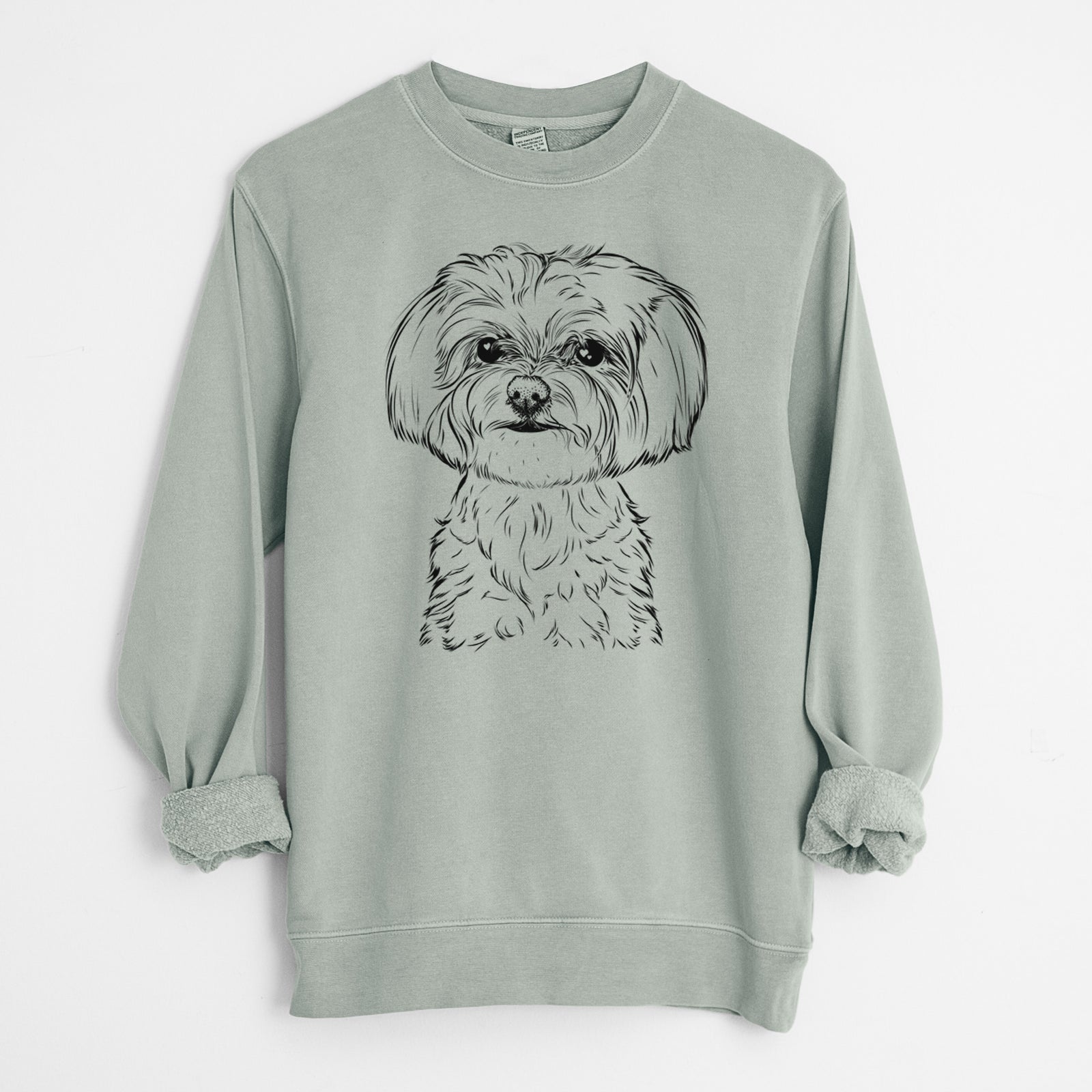 Hand-drawn sketch of Willow the Maltese on a Sage Unisex pigment dyed crew sweatshirt