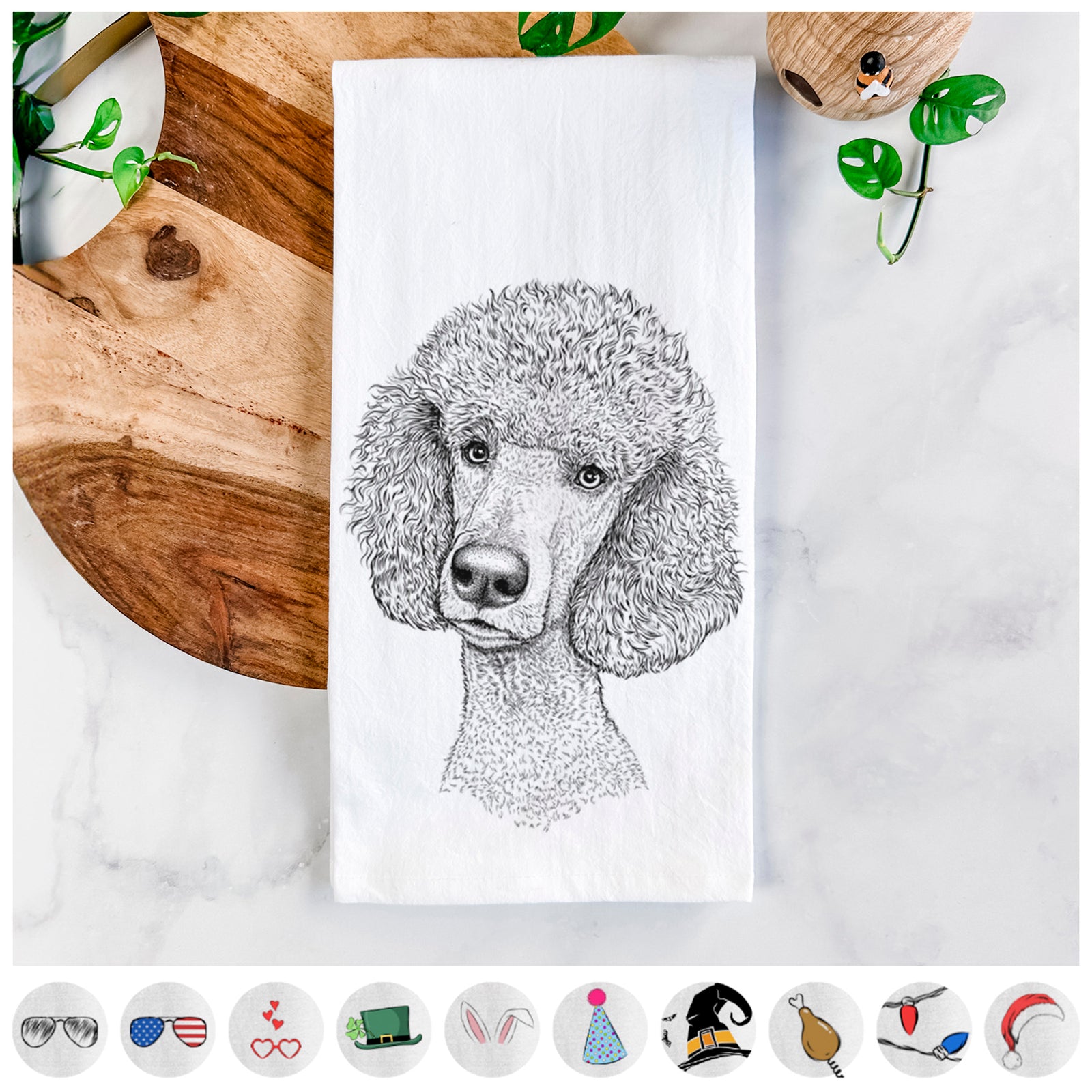 Hand-drawn sketch of Yuki the Poodle on a tea towel, shown with icons of the other available costume styles