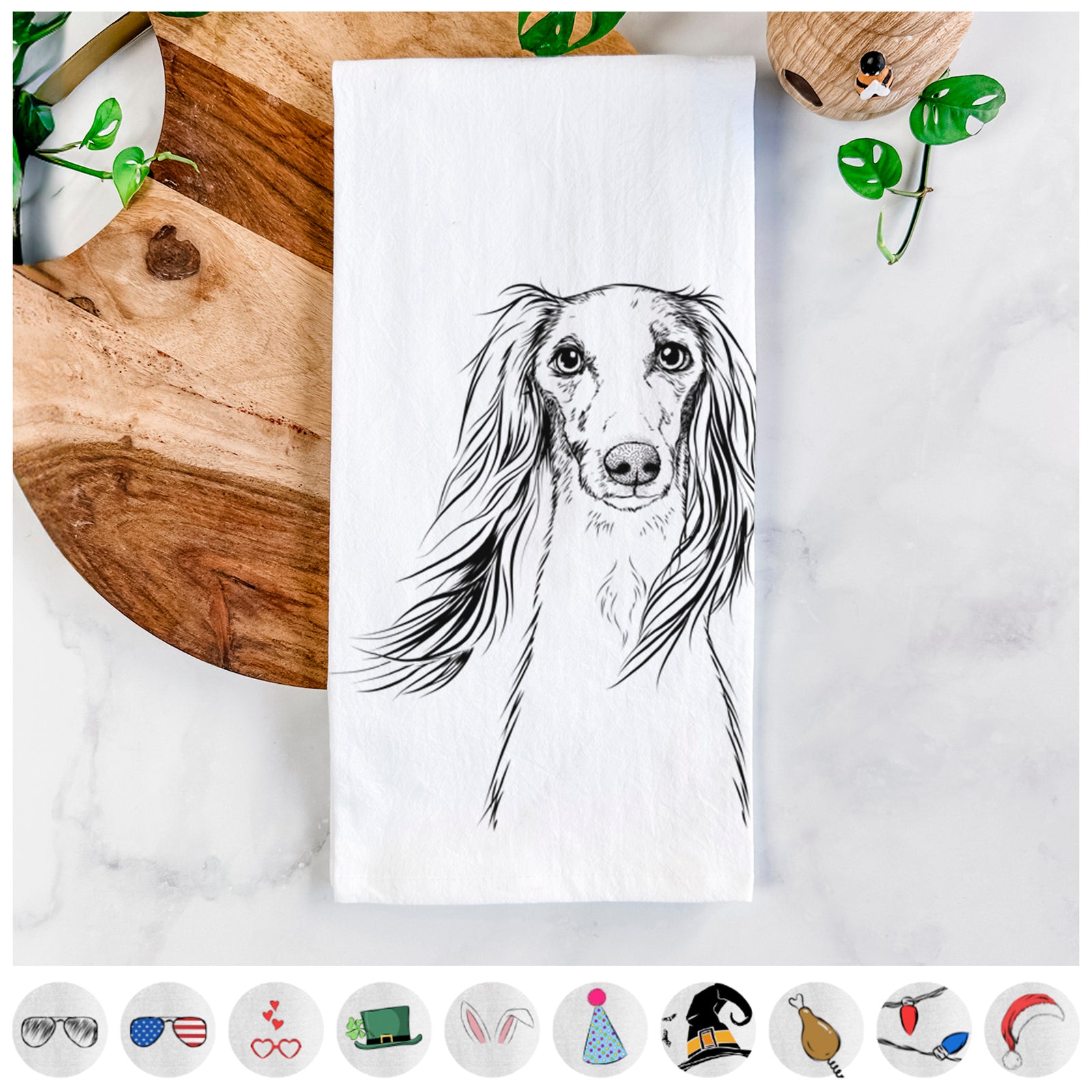 Hand-drawn sketch of Zahra the Saluki on a tea towel, shown with icons of the other available costume styles