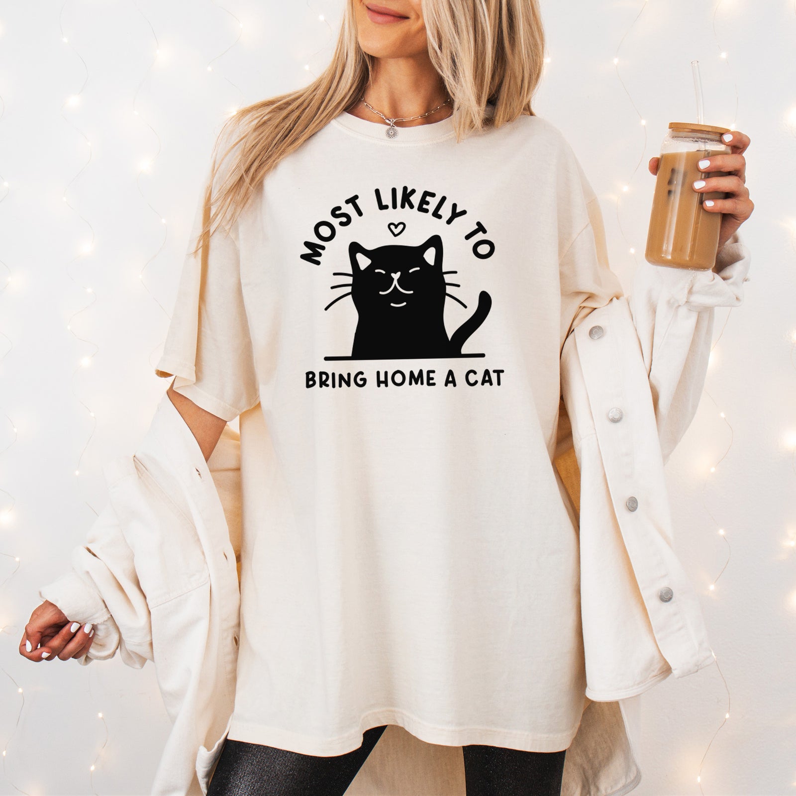 Most Likely to Bring Home a Cat - Black - Unisex Comfort Colors Garment-Dyed Heavyweight T-shirt, worn by model