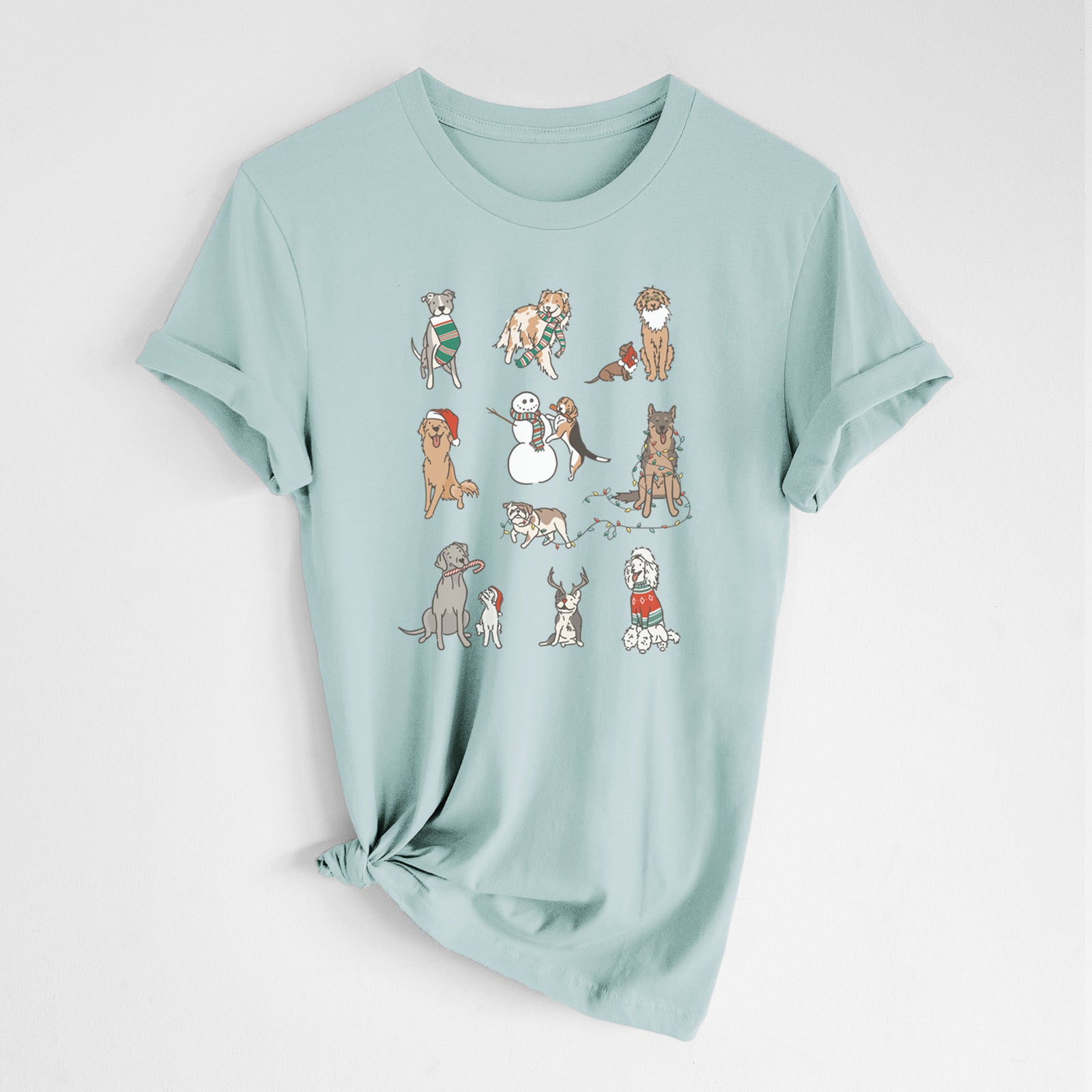 'Christmas Pups' design on a Dusty Blue Unisex crewneck, worn by a woman