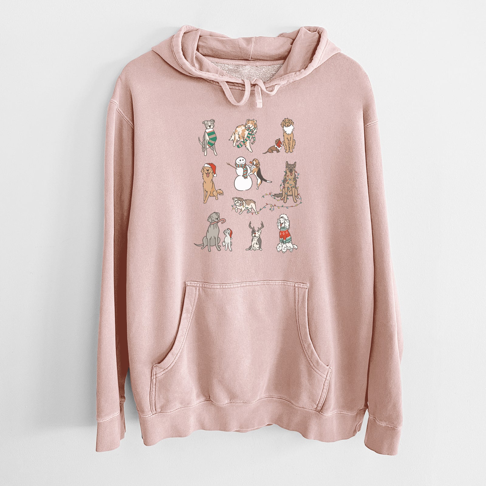 'Christmas Pups' design on a Dusty Pink Unisex pigment dyed hoodie