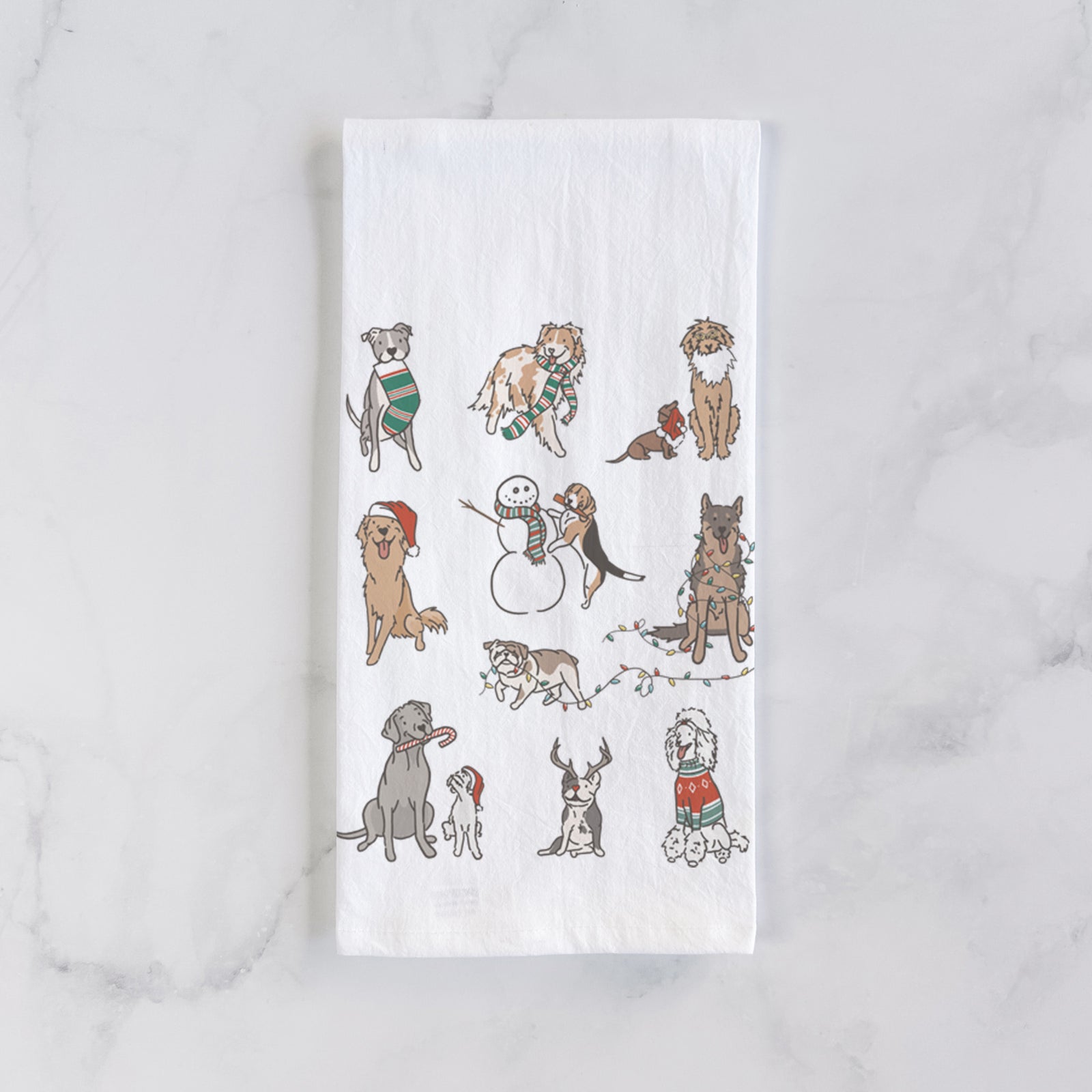 'Christmas Pups' design on a tea towel