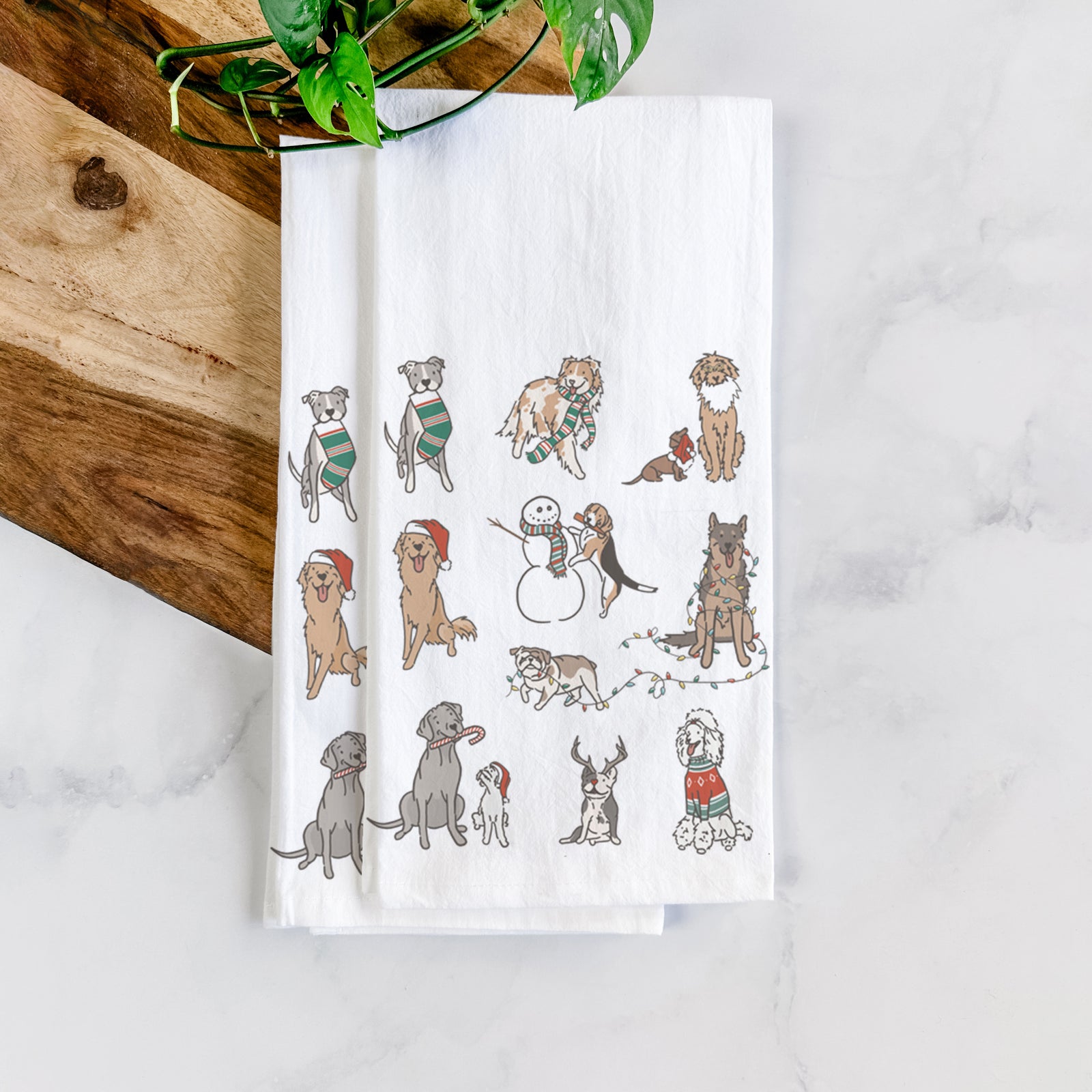 'Christmas Pups' design on a tea towel