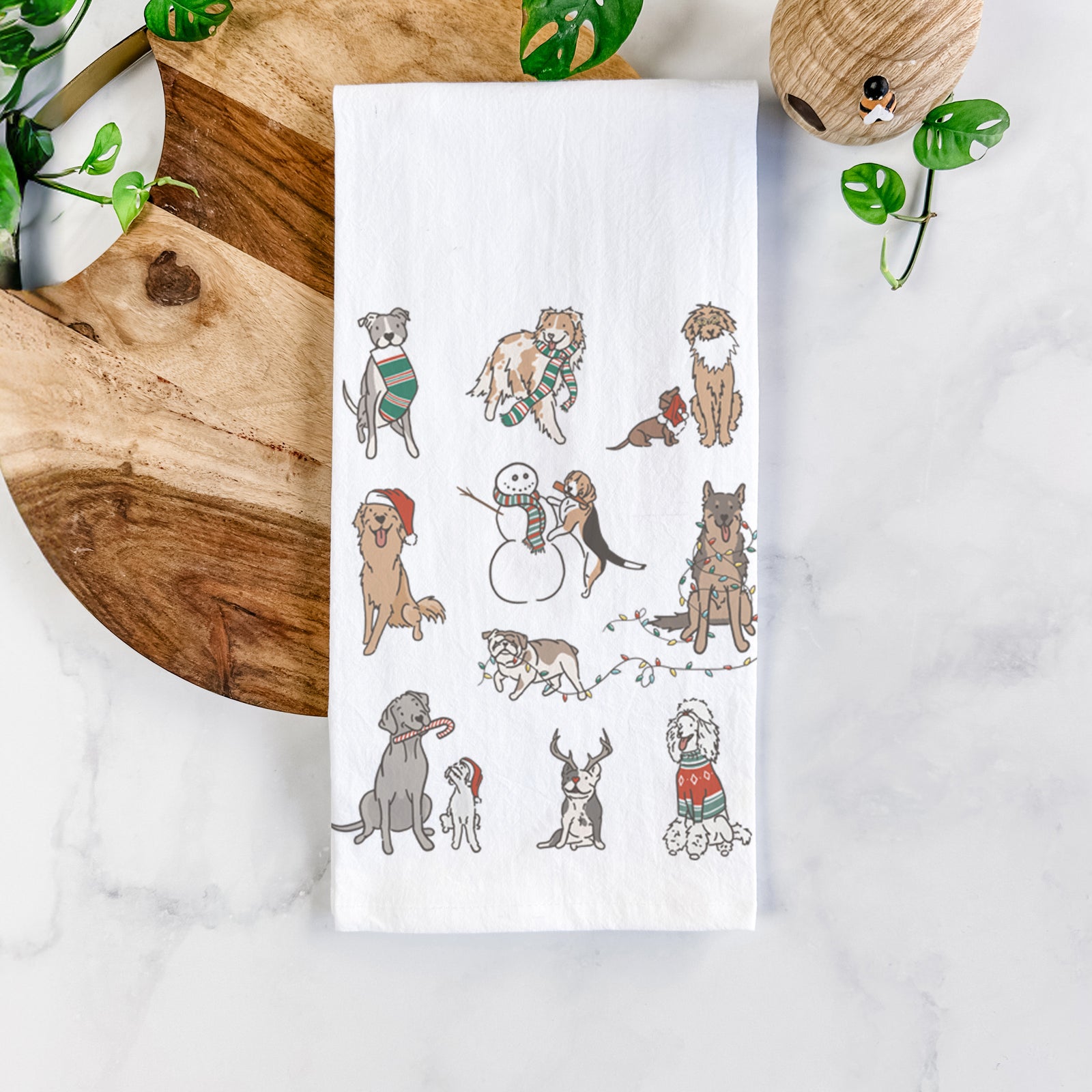 'Christmas Pups' design on a tea towel