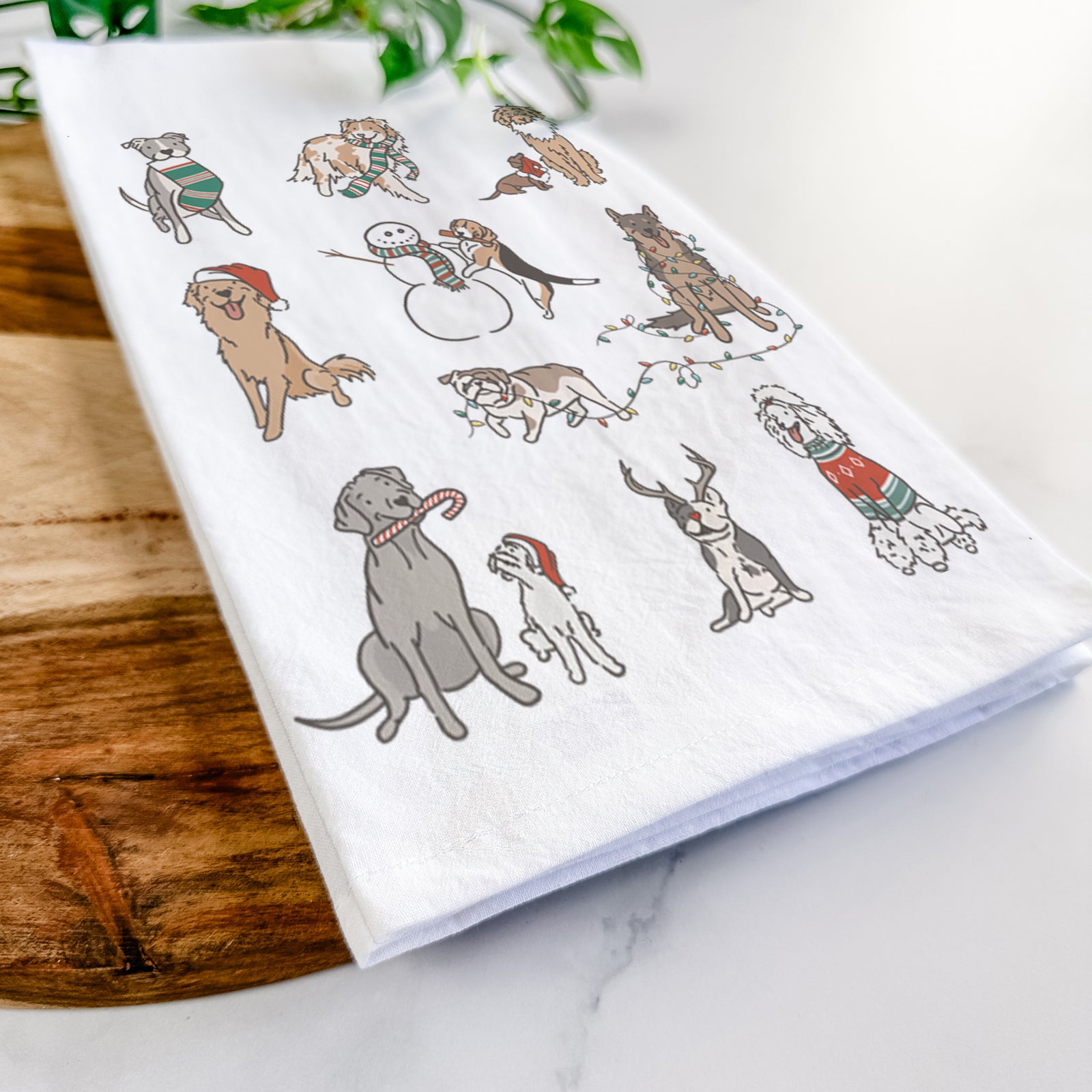'Christmas Pups' design on a tea towel