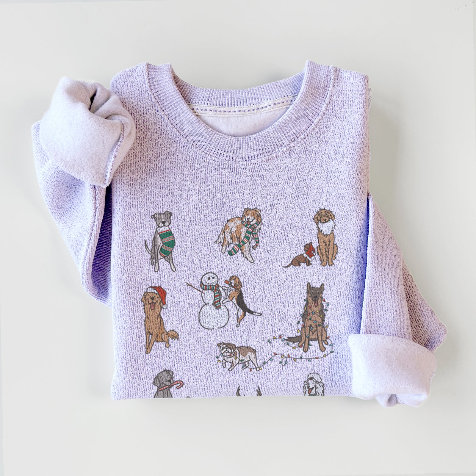 'Christmas Pups' design on an Ice Purple knit sweatshirt
