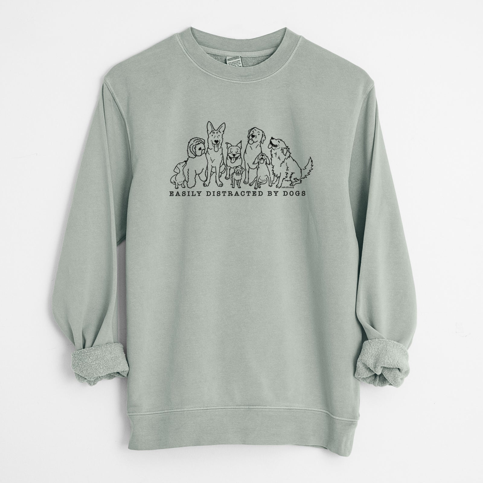 'Distracted by Dogs' design on a Sage Unisex pigment dyed crew sweatshirt