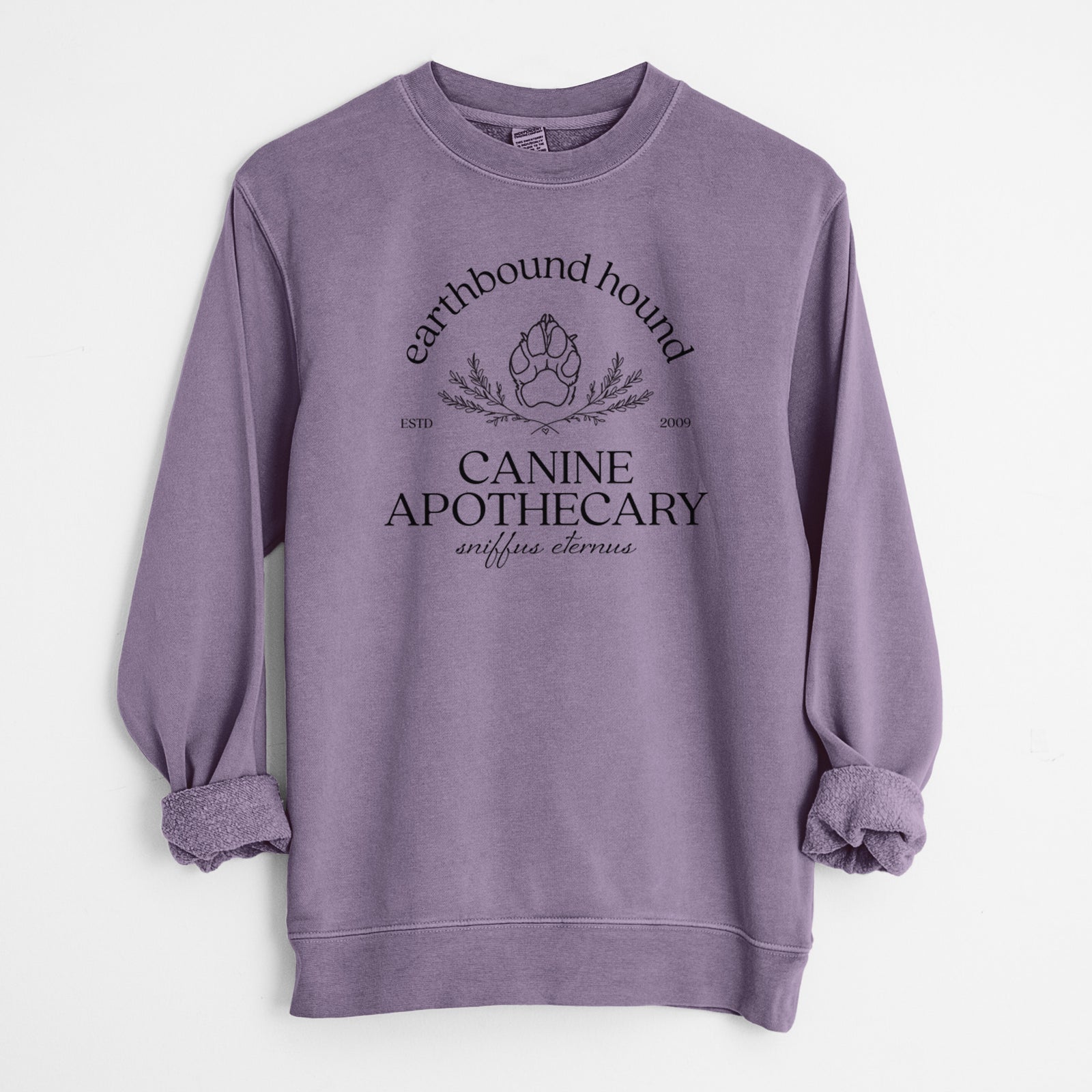 'Earthbound Hound – Canine Apothecary' design on a Plum Unisex pigment dyed crew sweatshirt
