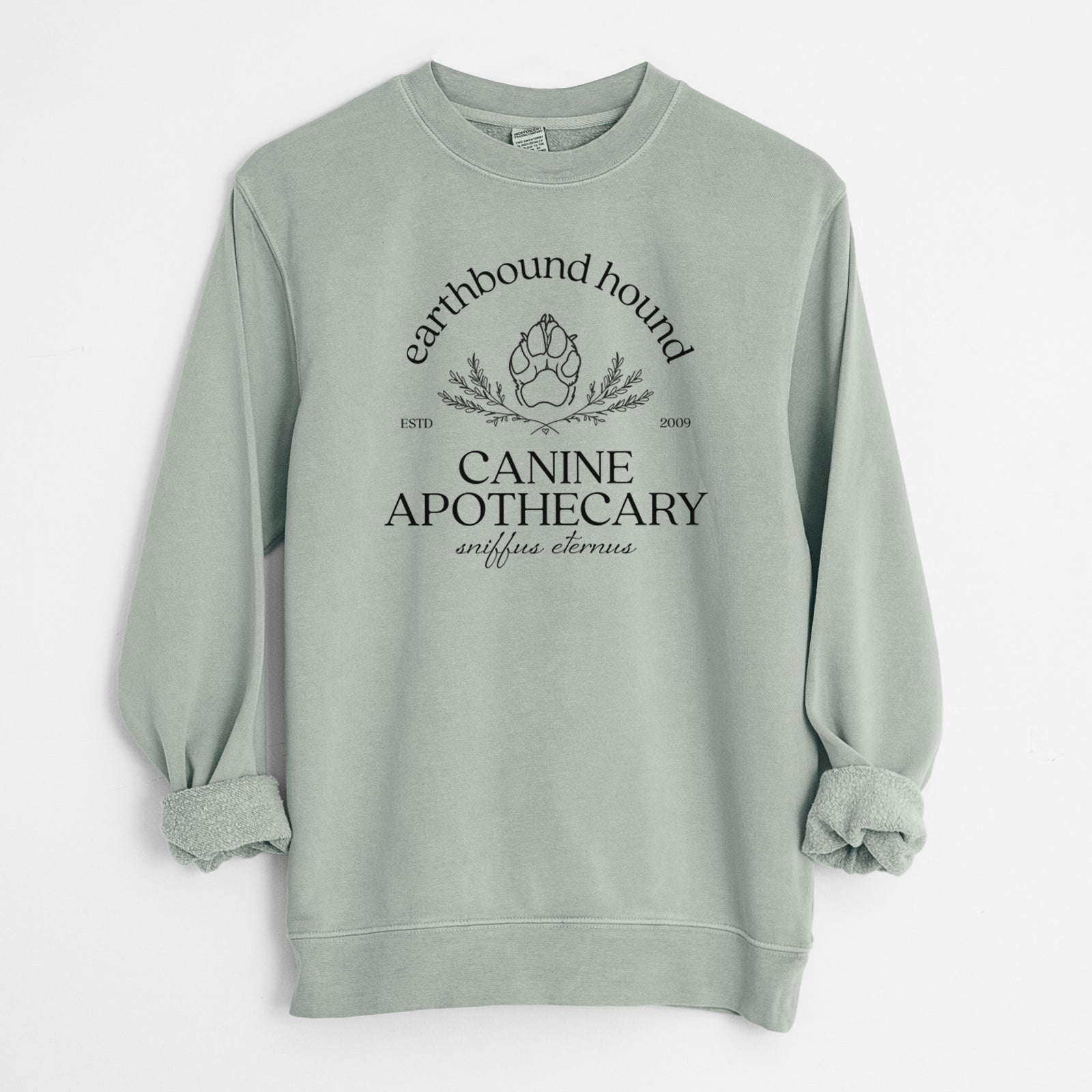 'Earthbound Hound – Canine Apothecary' design on a Sage Unisex pigment dyed crew sweatshirt