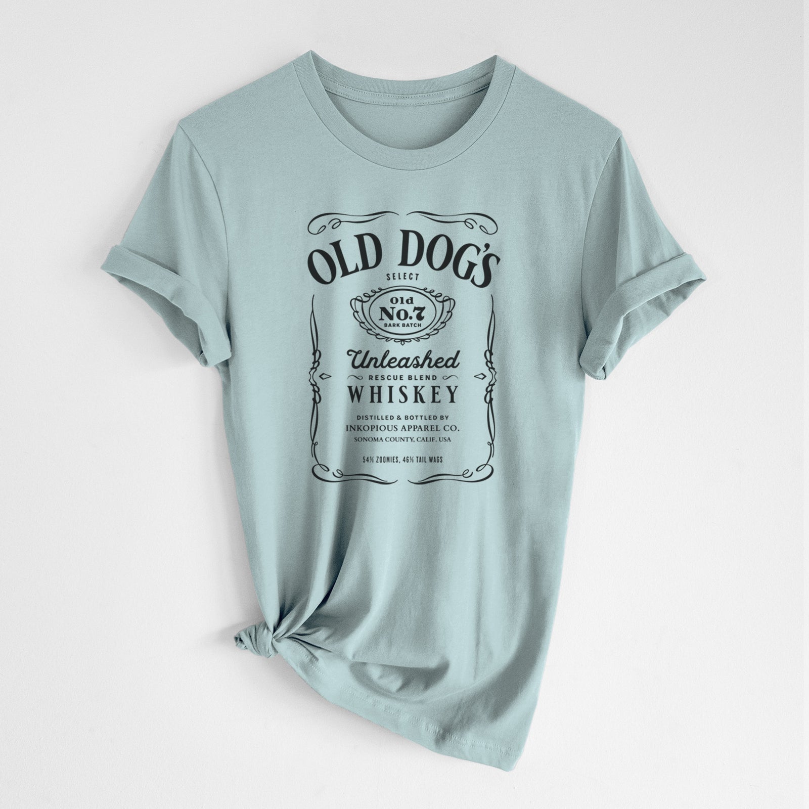 'Old Dog’s No. 7 – Unleashed Whiskey' design on a Dusty Blue Unisex crewneck, worn by a woman