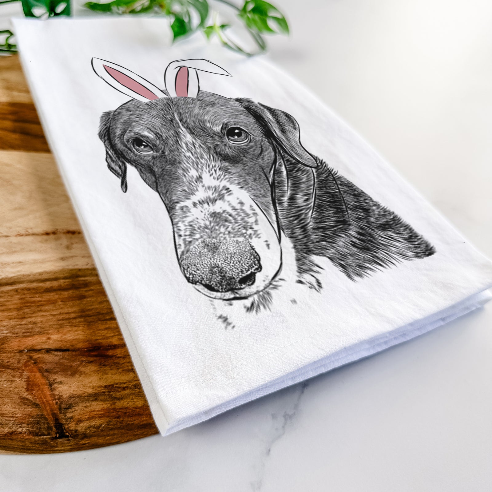 Hand-drawn sketch of Angel Orion the Mixed Breed wearing Easter bunny ears on a tea towel