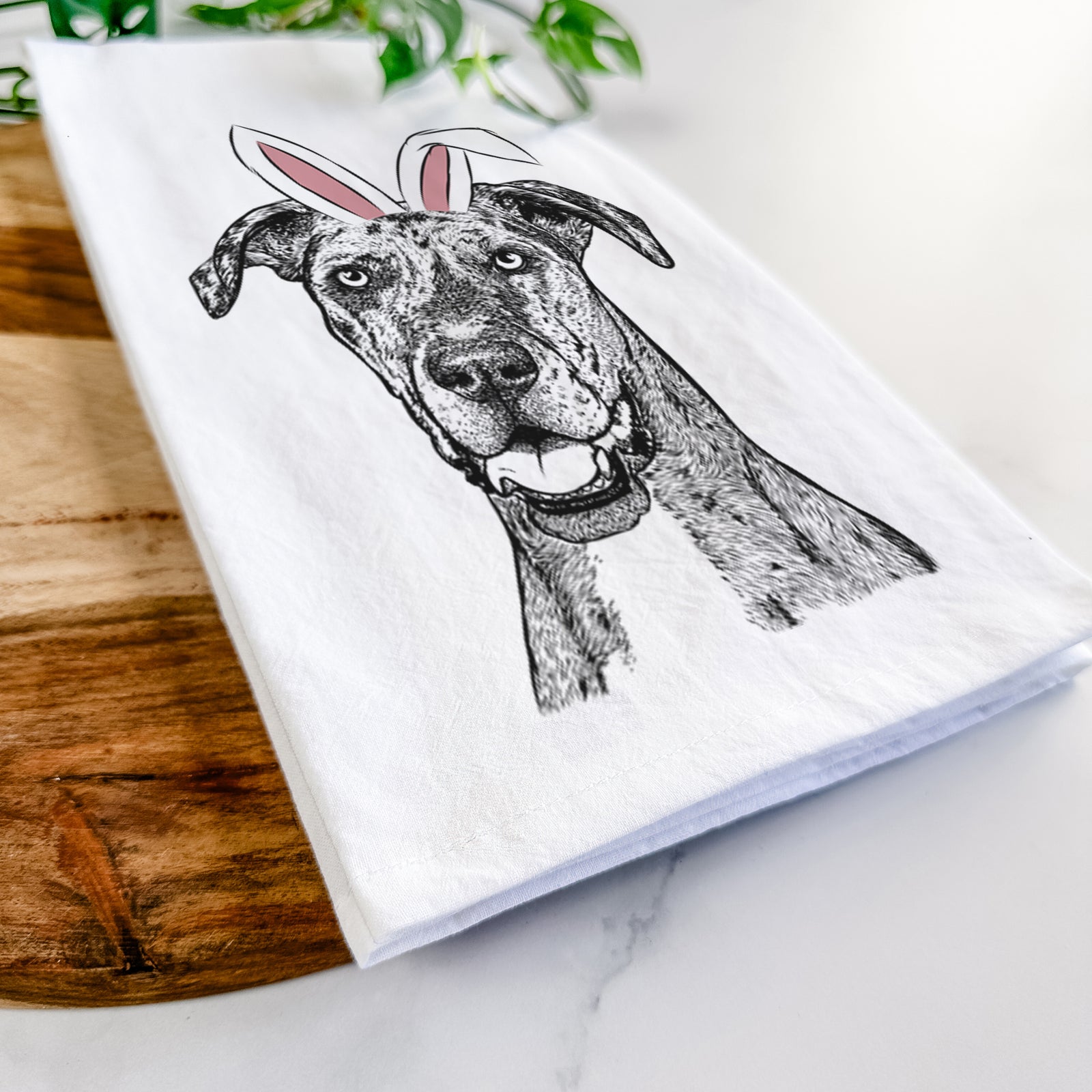 Hand-drawn sketch of Athena the Merle Great Dane wearing Easter bunny ears on a tea towel