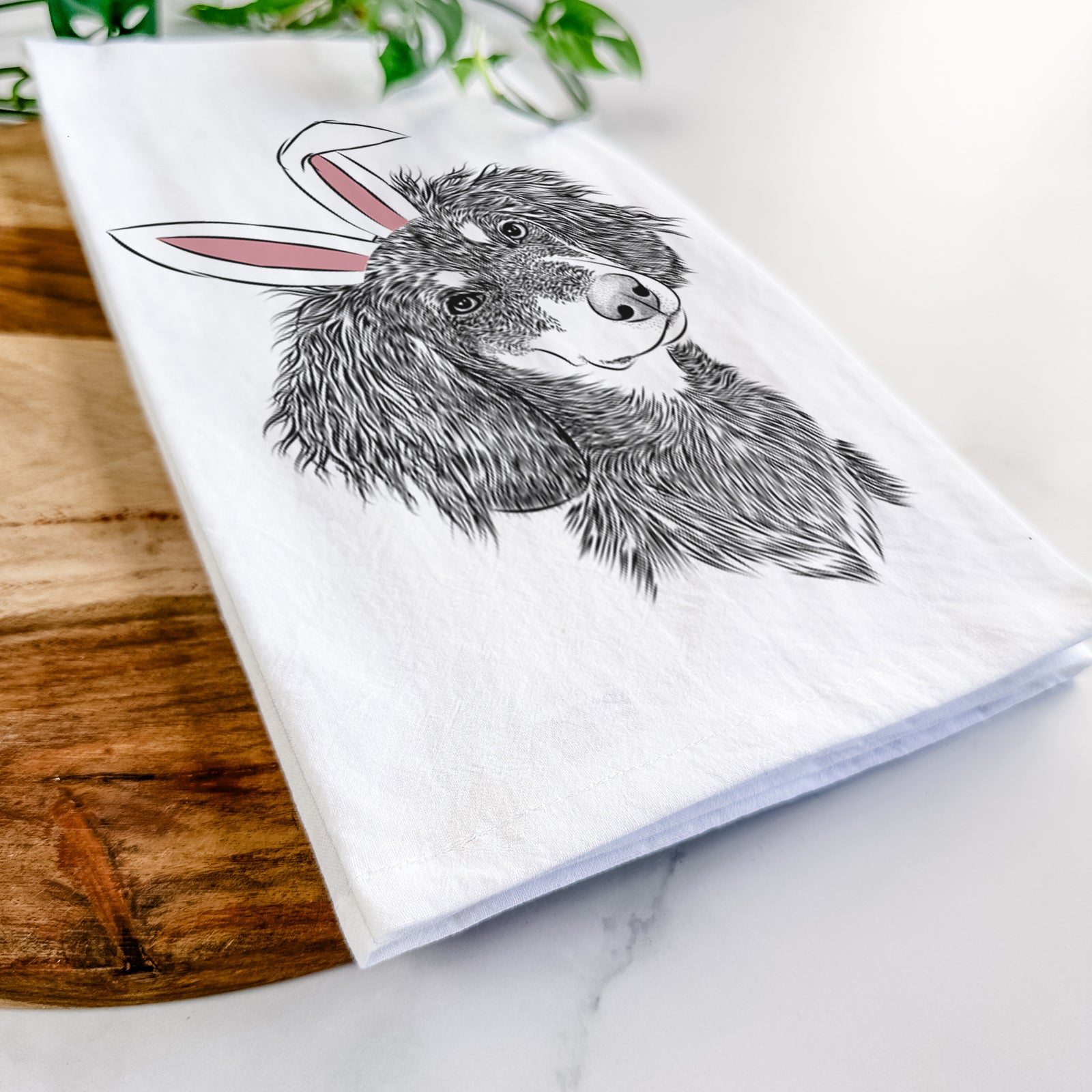 Hand-drawn sketch of Bailey the Long Haired Dachshund wearing Easter bunny ears on a tea towel