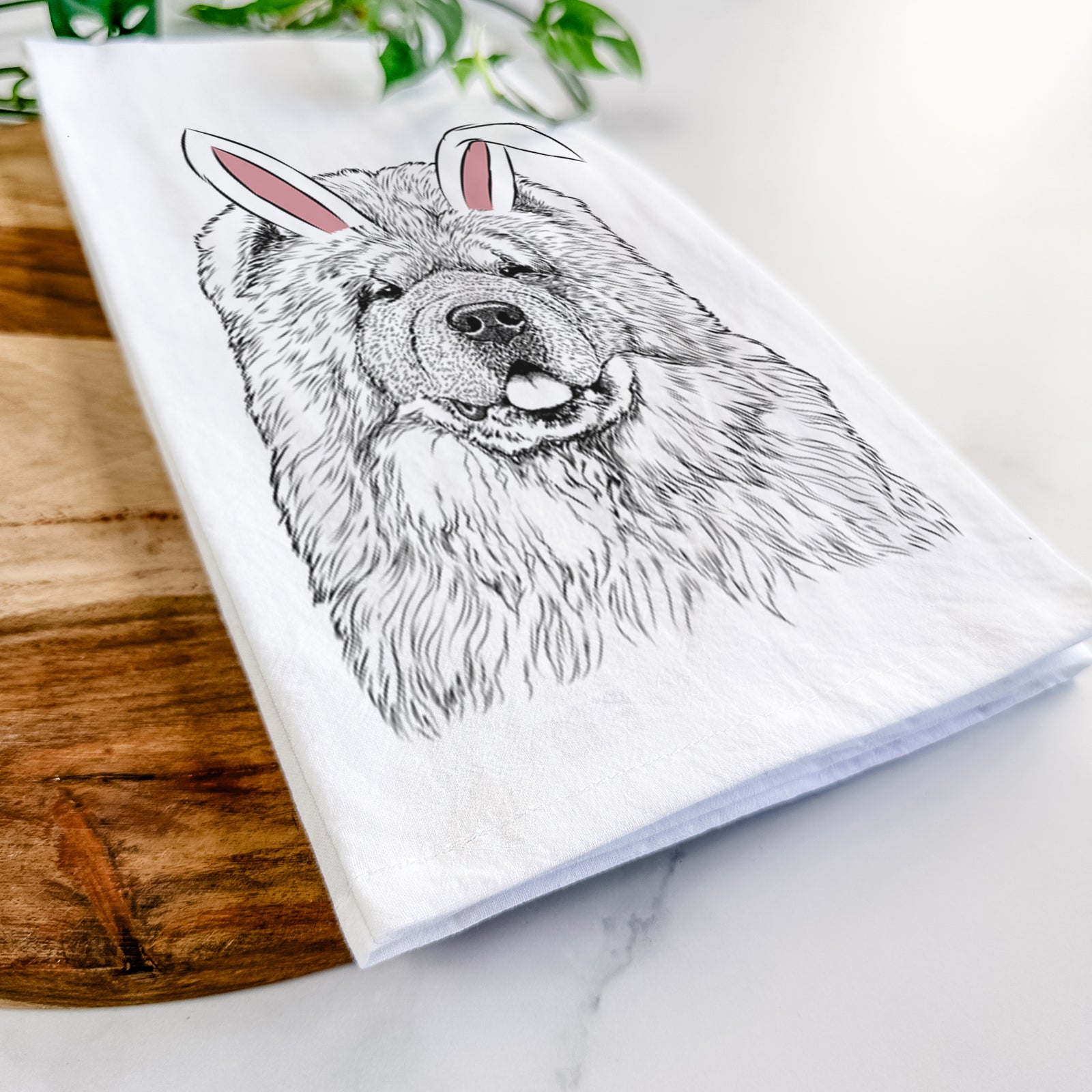 Hand-drawn sketch of Baloo the Chow Chow wearing Easter bunny ears on a tea towel