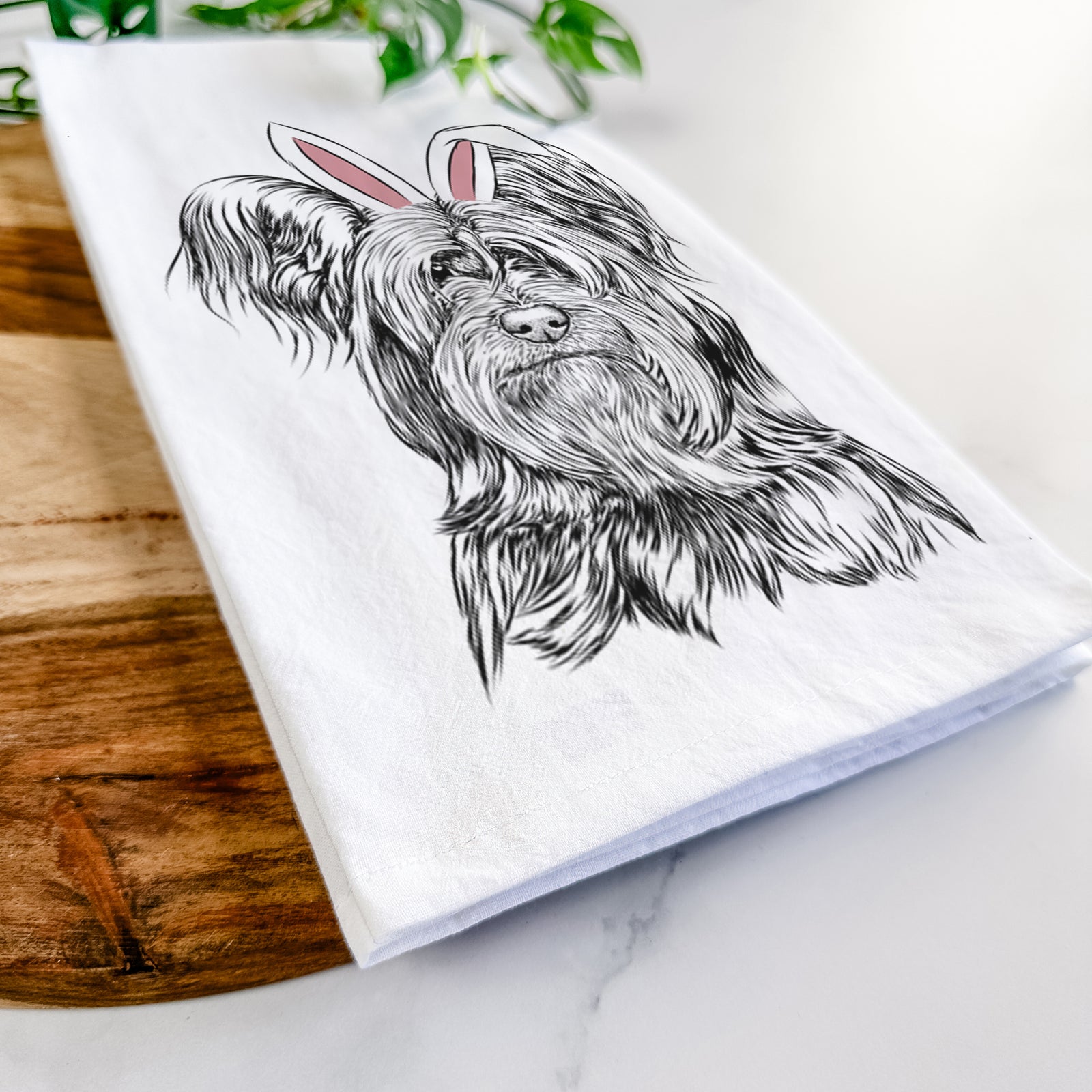 Hand-drawn sketch of Bandit the Skye Terrier wearing Easter bunny ears on a tea towel
