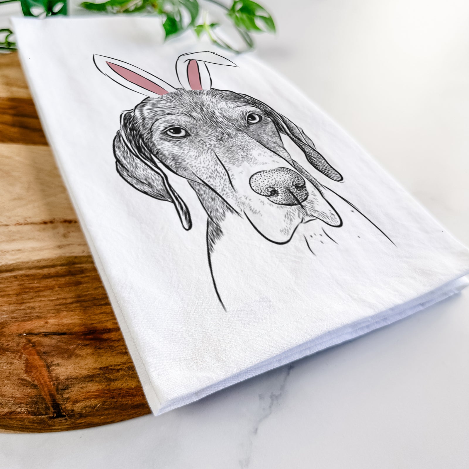 Hand-drawn sketch of Bohdi the German Shorthaired Pointer wearing Easter bunny ears on a tea towel