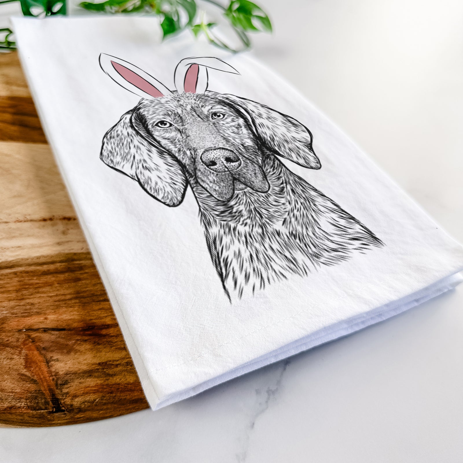 Hand-drawn sketch of Boone the Plott Hound wearing Easter bunny ears on a tea towel