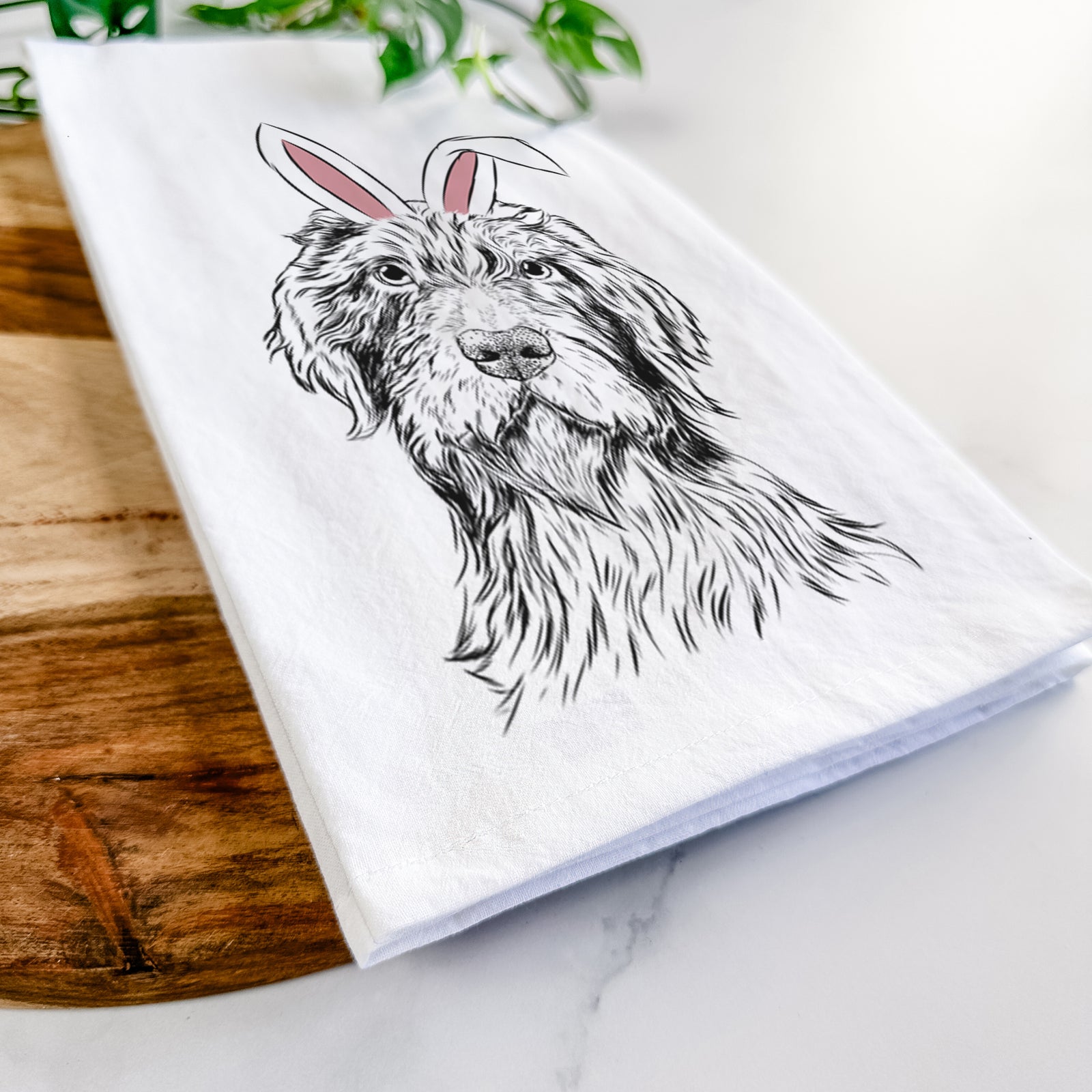 Hand-drawn sketch of Doc Holliday the Pudelpointer wearing Easter bunny ears on a tea towel