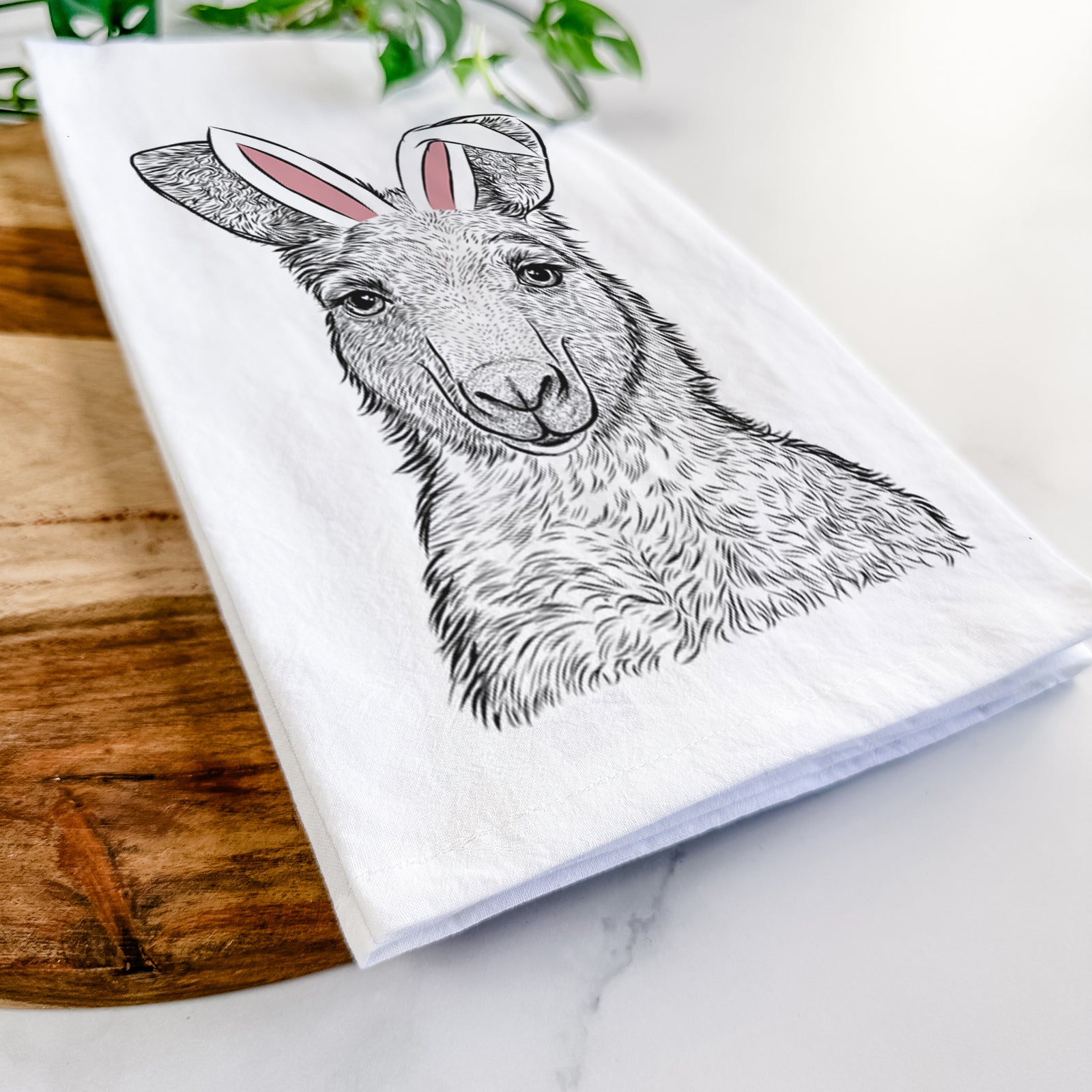 Hand-drawn sketch of Evelyn the Eastern Grey Kangaroo wearing Easter bunny ears on a tea towel