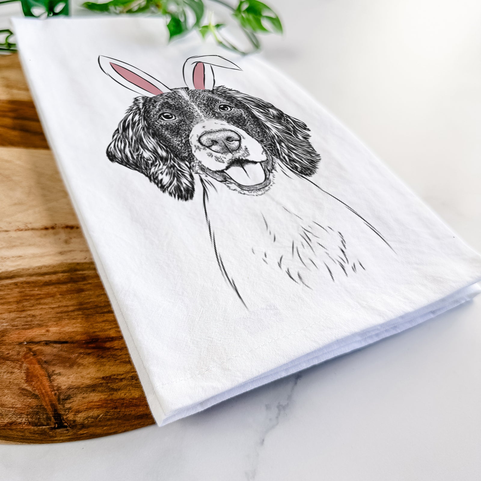 Hand-drawn sketch of Ever the English Springer Spaniel wearing Easter bunny ears on a tea towel