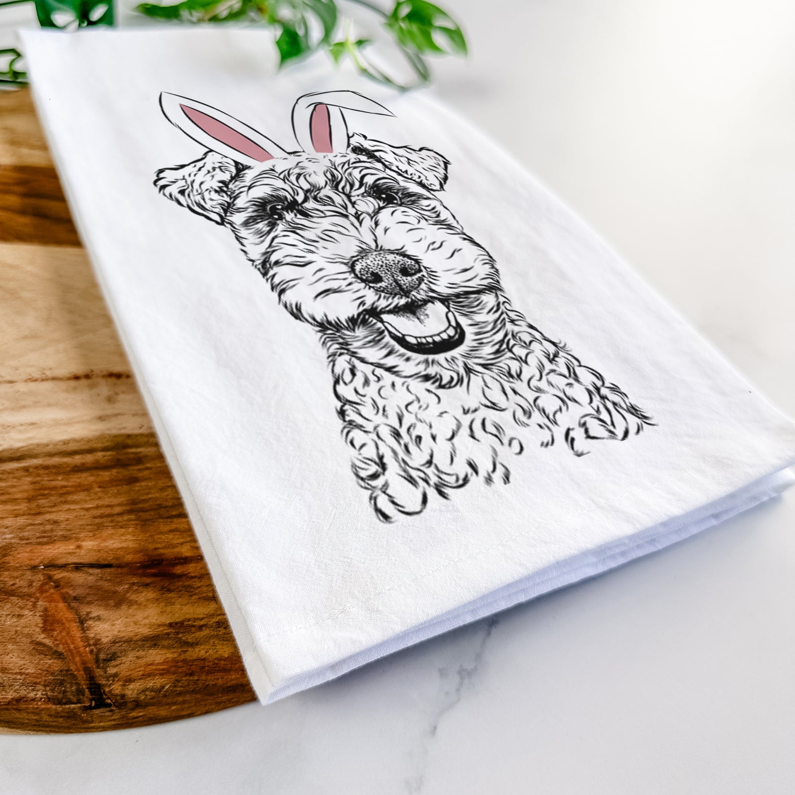Hand-drawn sketch of Fintan the Irish Troodle wearing Easter bunny ears on a tea towel
