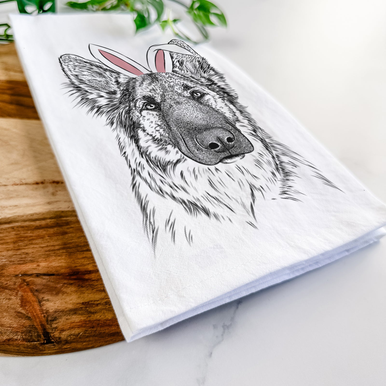 Hand-drawn sketch of Geddy the Shiloh Shepherd wearing Easter bunny ears on a tea towel