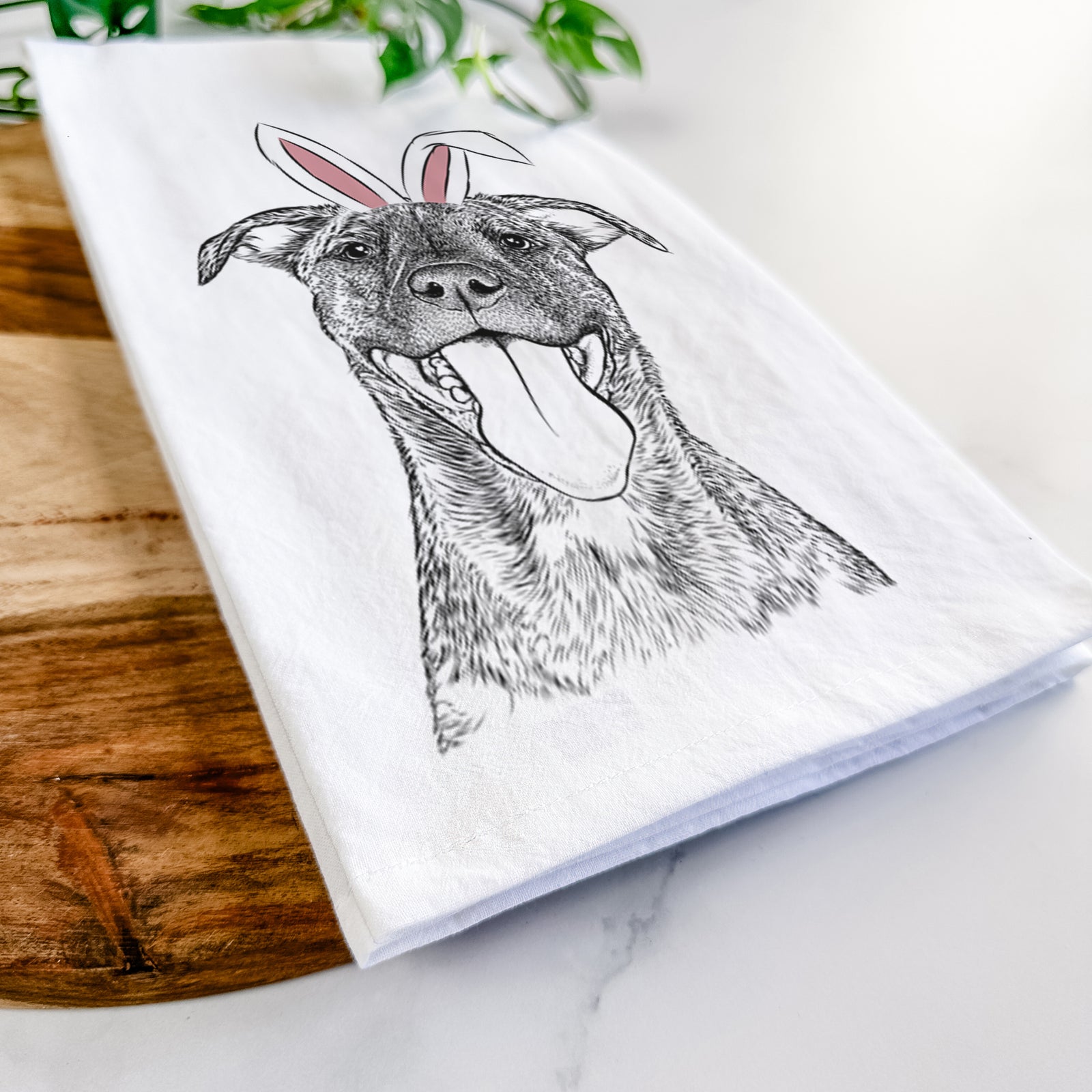 Hand-drawn sketch of Harley the Pitbull Mix wearing Easter bunny ears on a tea towel