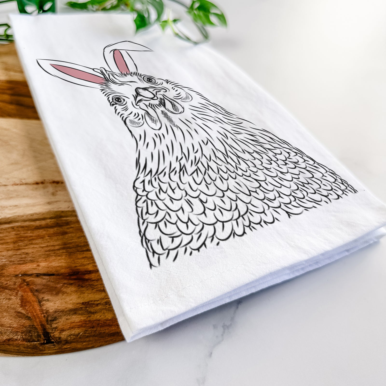 Hand-drawn sketch of Henrietta the Chicken wearing Easter bunny ears on a tea towel