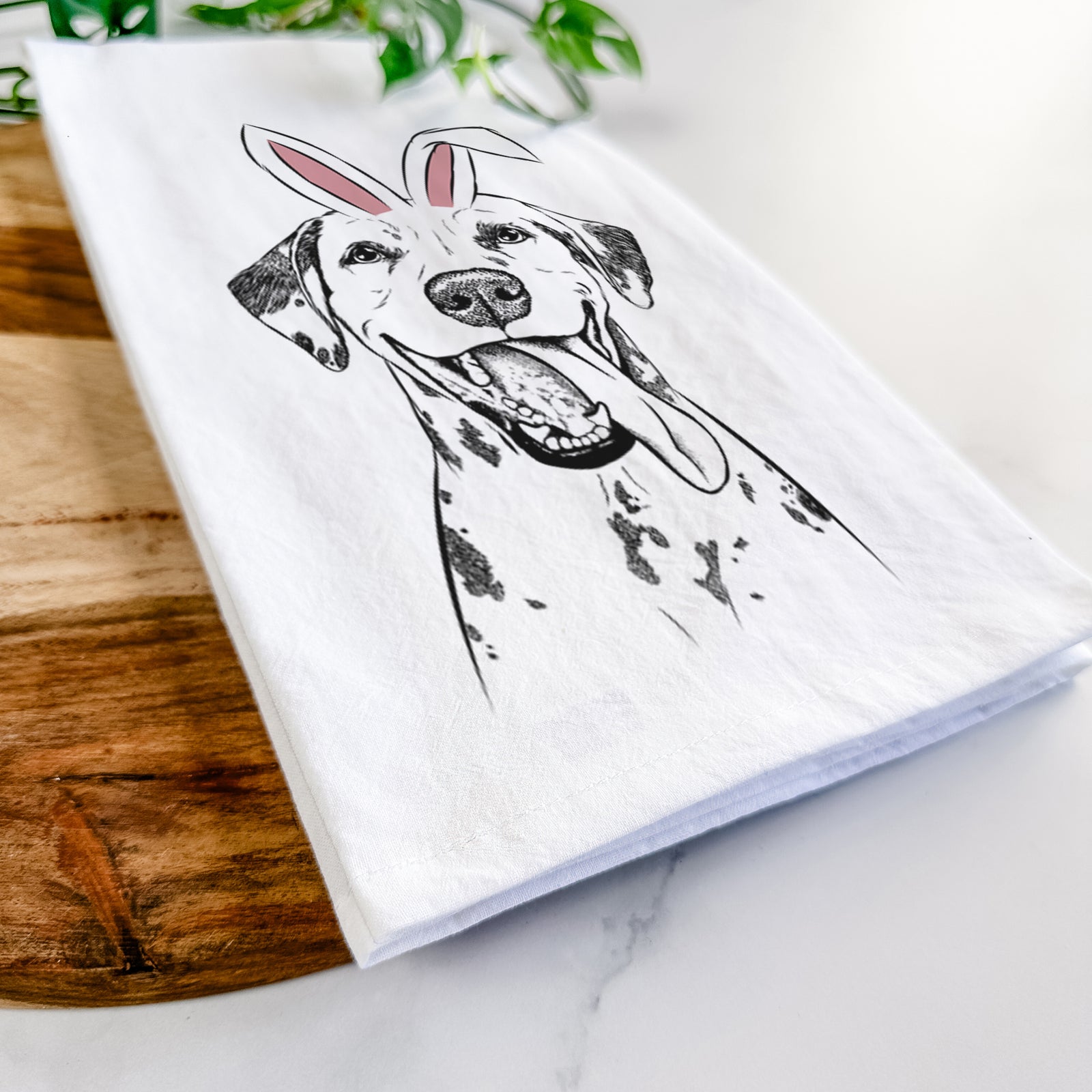 Hand-drawn sketch of Hydro the Dalmatian wearing Easter bunny ears on a tea towel