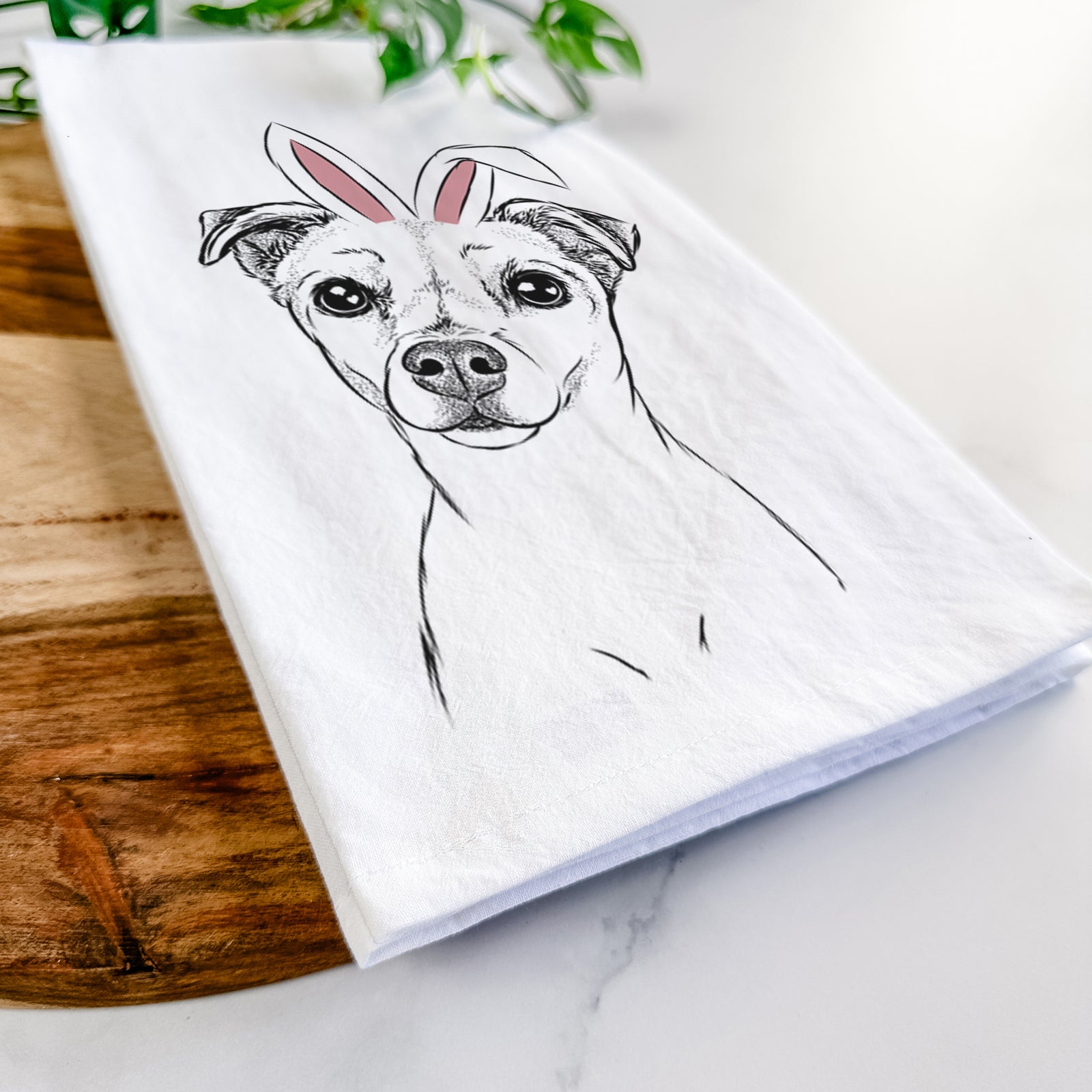 Hand-drawn sketch of Izzy the Chiweenie wearing Easter bunny ears on a tea towel
