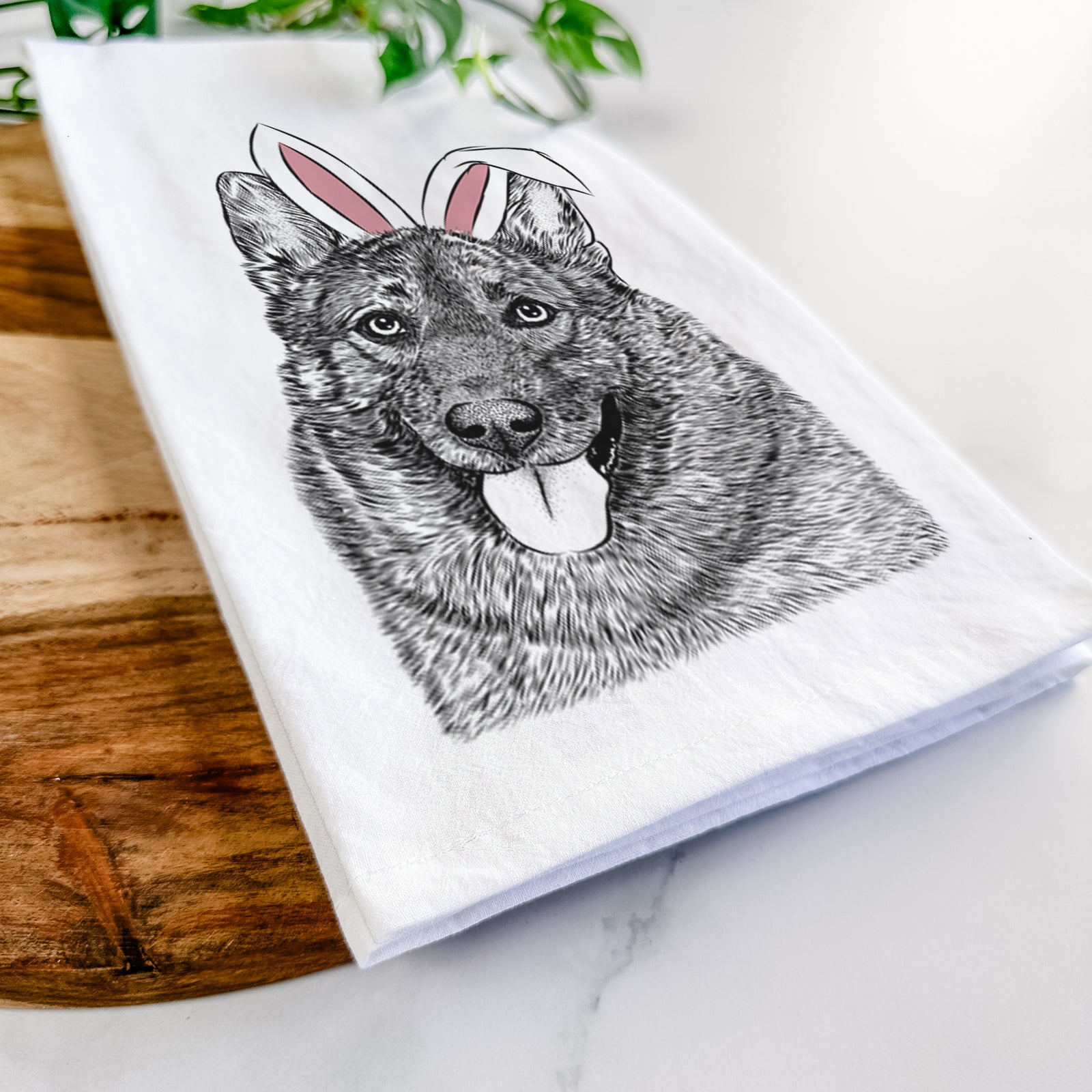 Hand-drawn sketch of Kasia the Norwegian Elkhound wearing Easter bunny ears on a tea towel