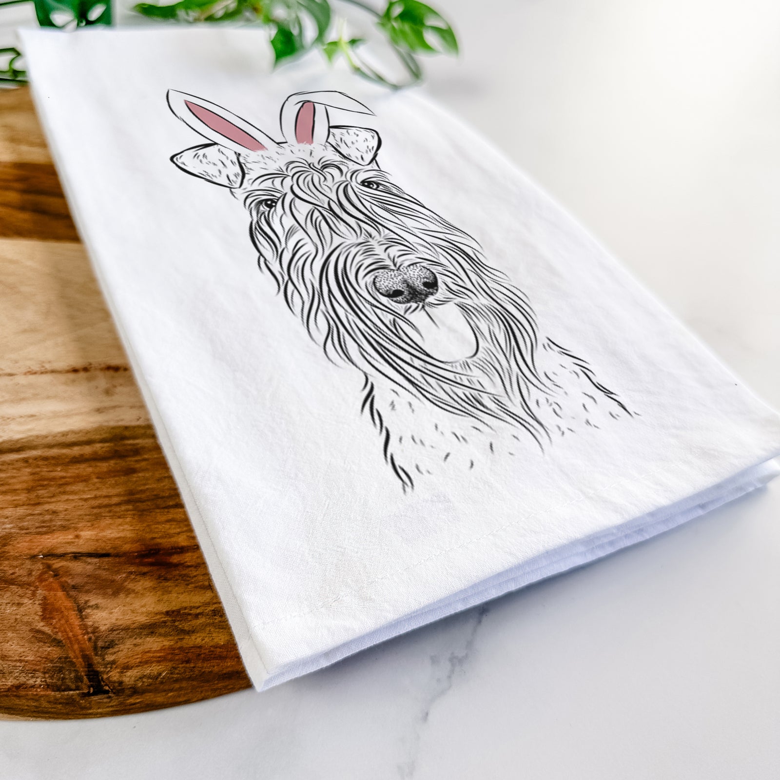 Hand-drawn sketch of Kricket the Kerry Blue Terrier wearing Easter bunny ears on a tea towel