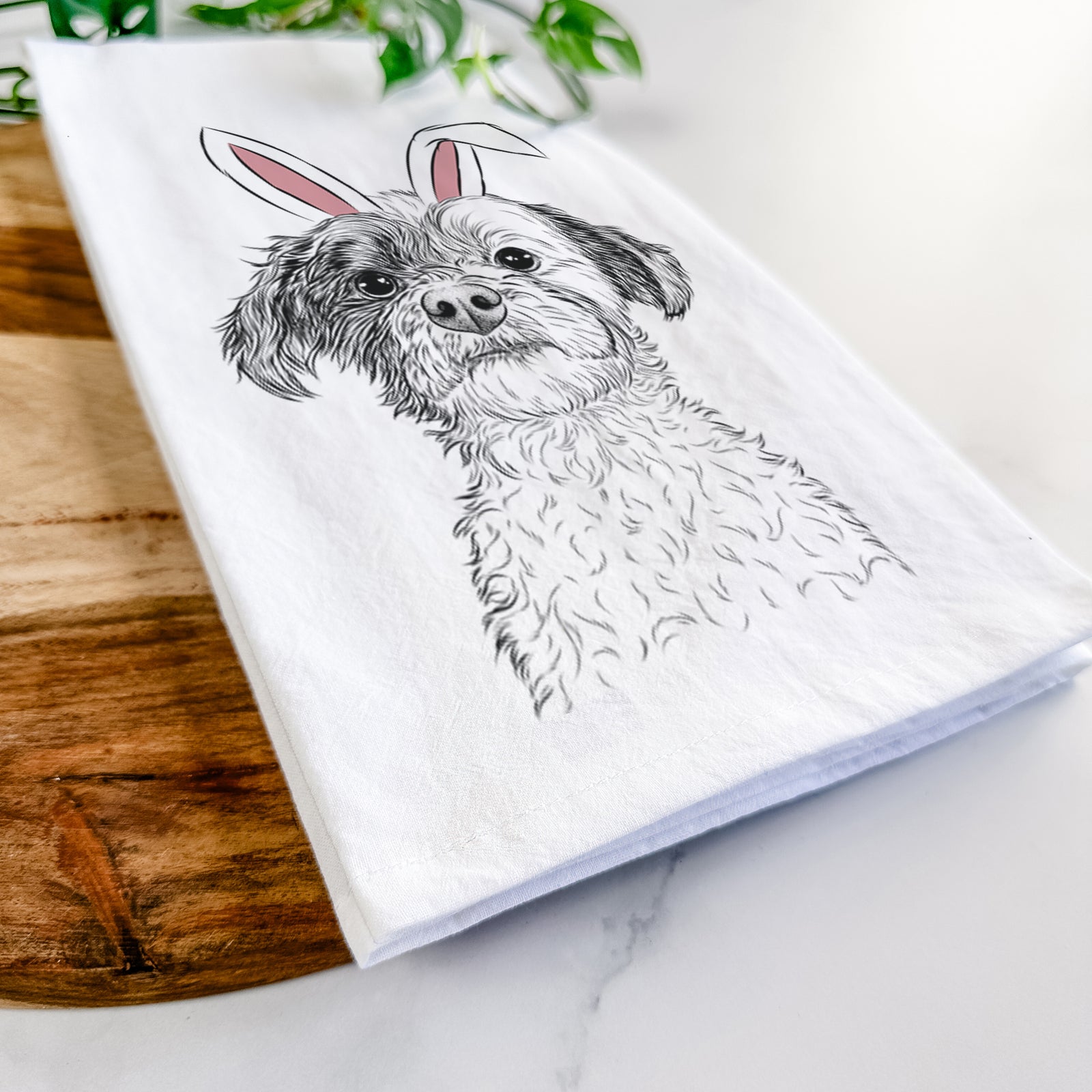 Hand-drawn sketch of Louise the Havanese wearing Easter bunny ears on a tea towel