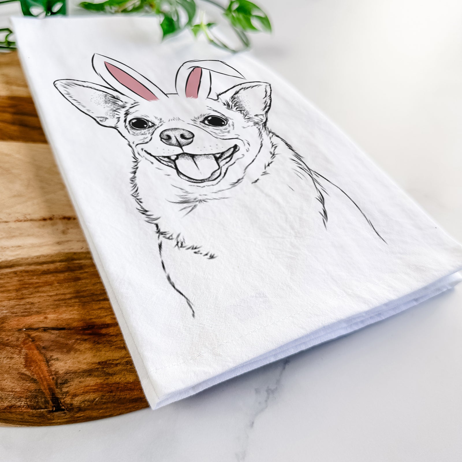 Hand-drawn sketch of Maddison Pearl the Chihuahua wearing Easter bunny ears on a tea towel