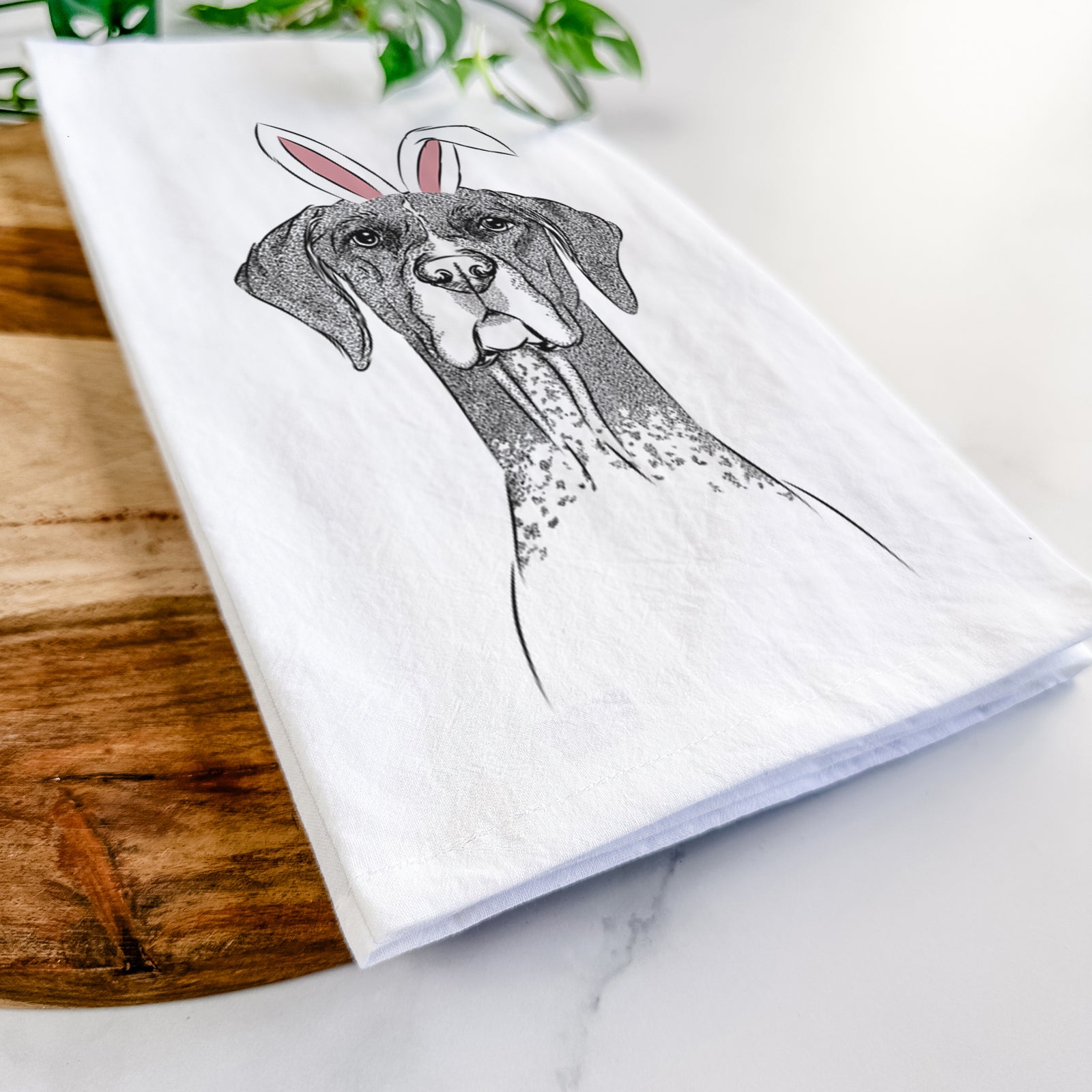Hand-drawn sketch of Mattis the German Shorthaired Pointer wearing Easter bunny ears on a tea towel