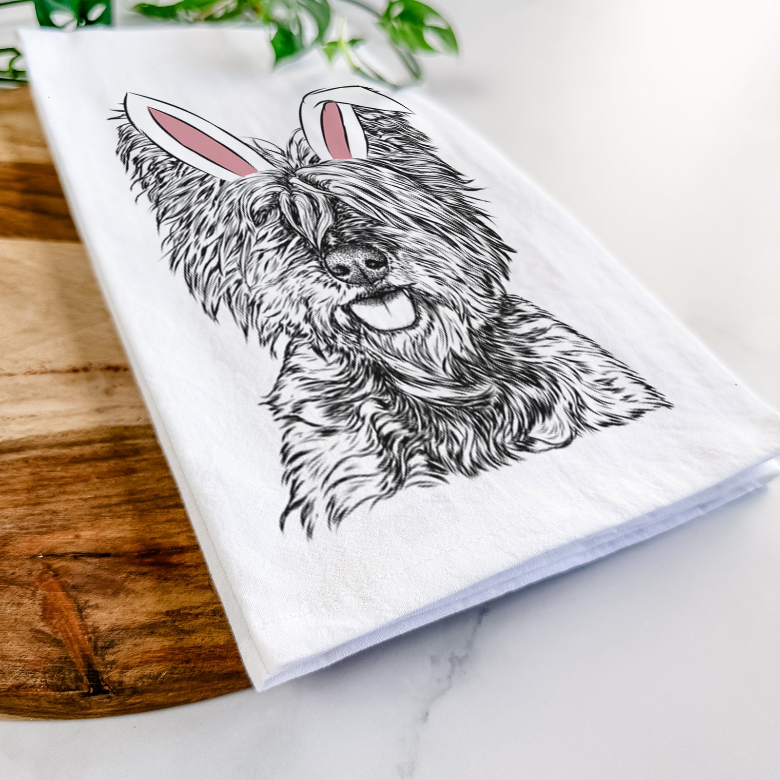 Hand-drawn sketch of McDuff the Cairn Terrier wearing Easter bunny ears on a tea towel