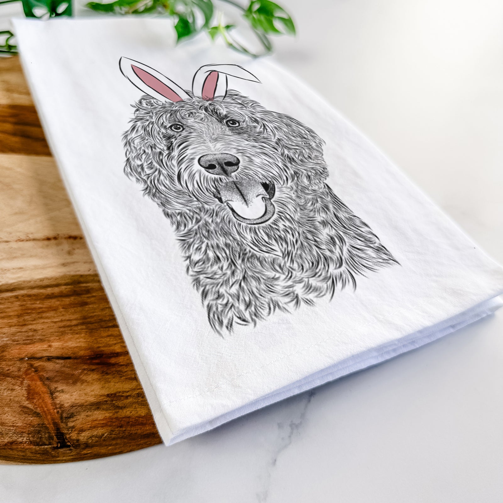 Hand-drawn sketch of Murr Dog the Labradoodle wearing Easter bunny ears on a tea towel