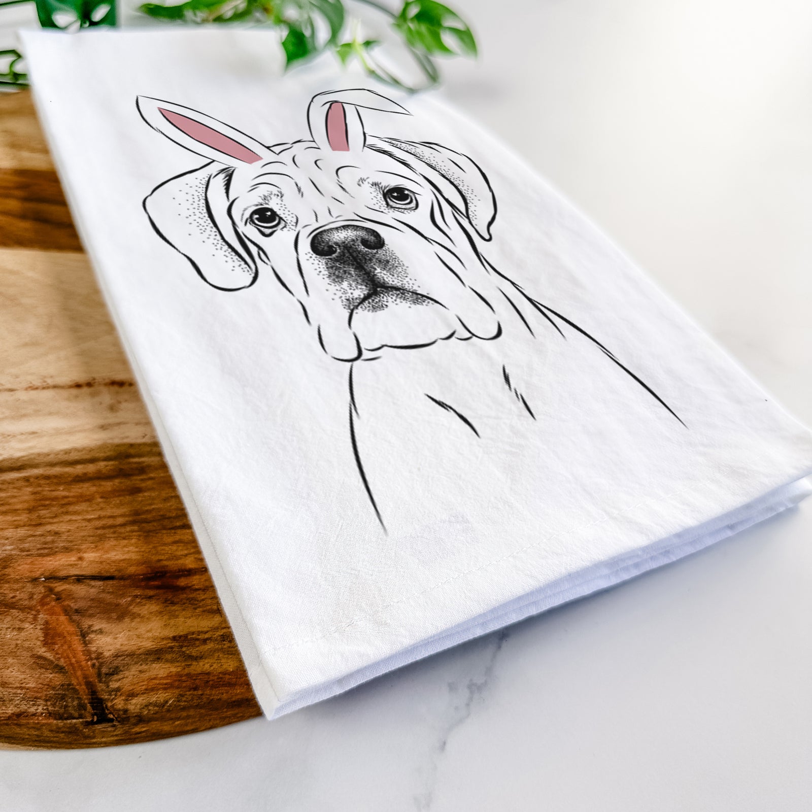 Hand-drawn sketch of Nelly the Boxer wearing Easter bunny ears on a tea towel
