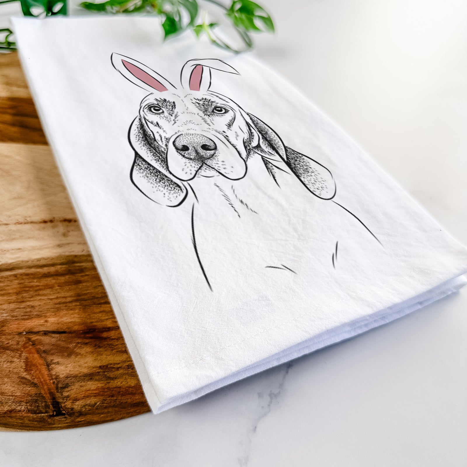 Hand-drawn sketch of Norman the Plott Hound wearing Easter bunny ears on a tea towel